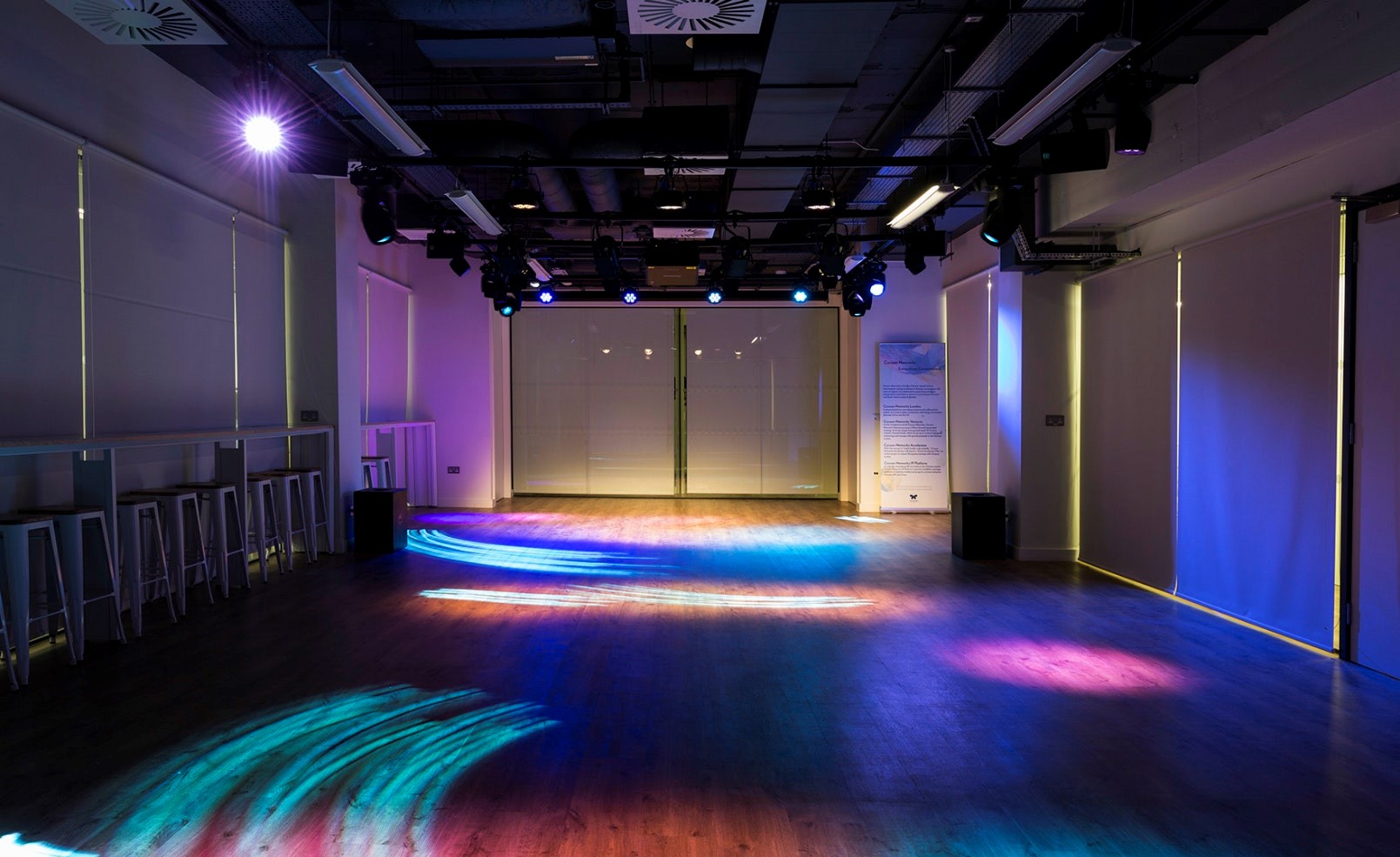 Cocoon Space: versatile event venue with polished wooden floor for meetings and gatherings.