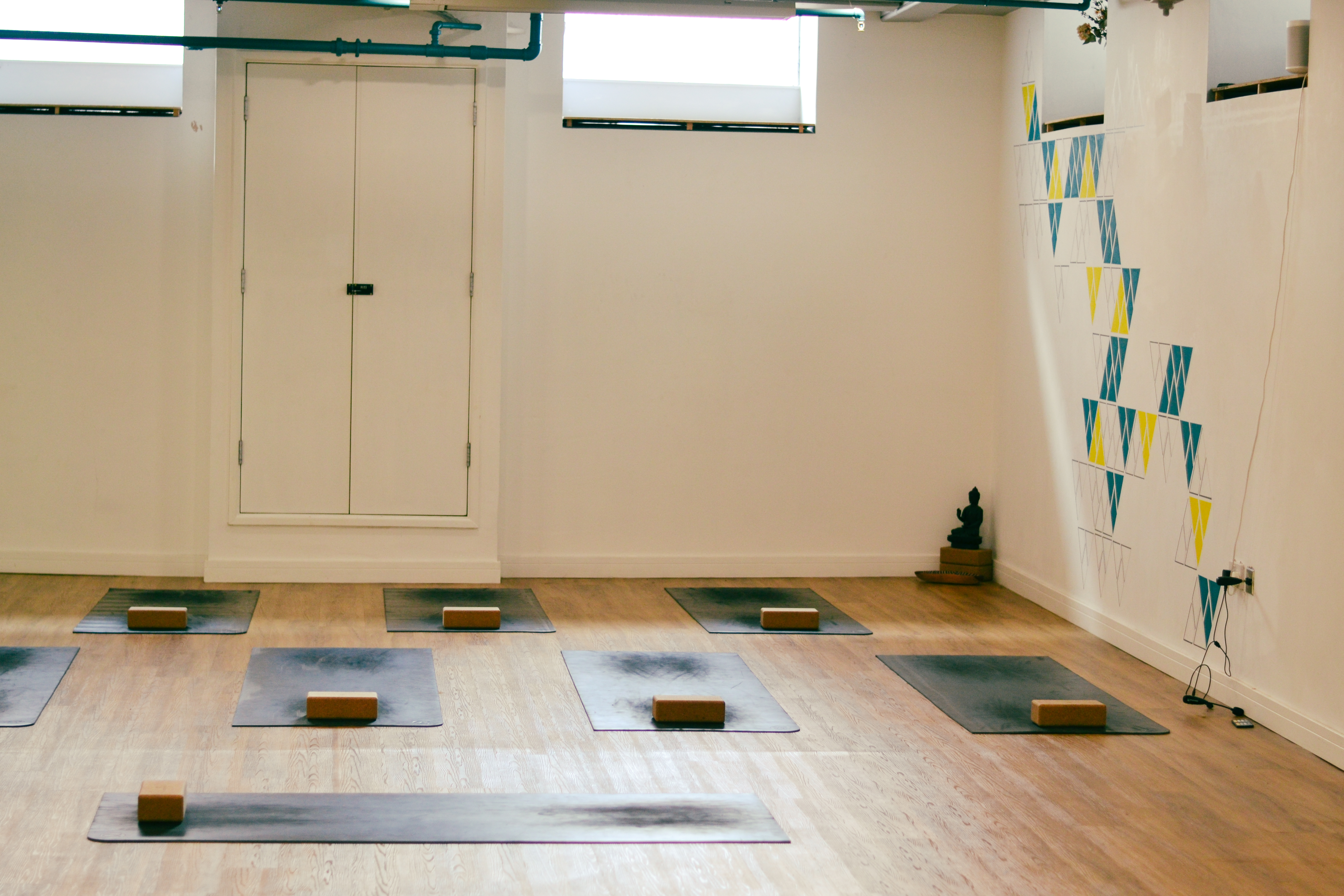 Serene yoga studio with natural light, perfect for wellness retreats and mindfulness workshops.