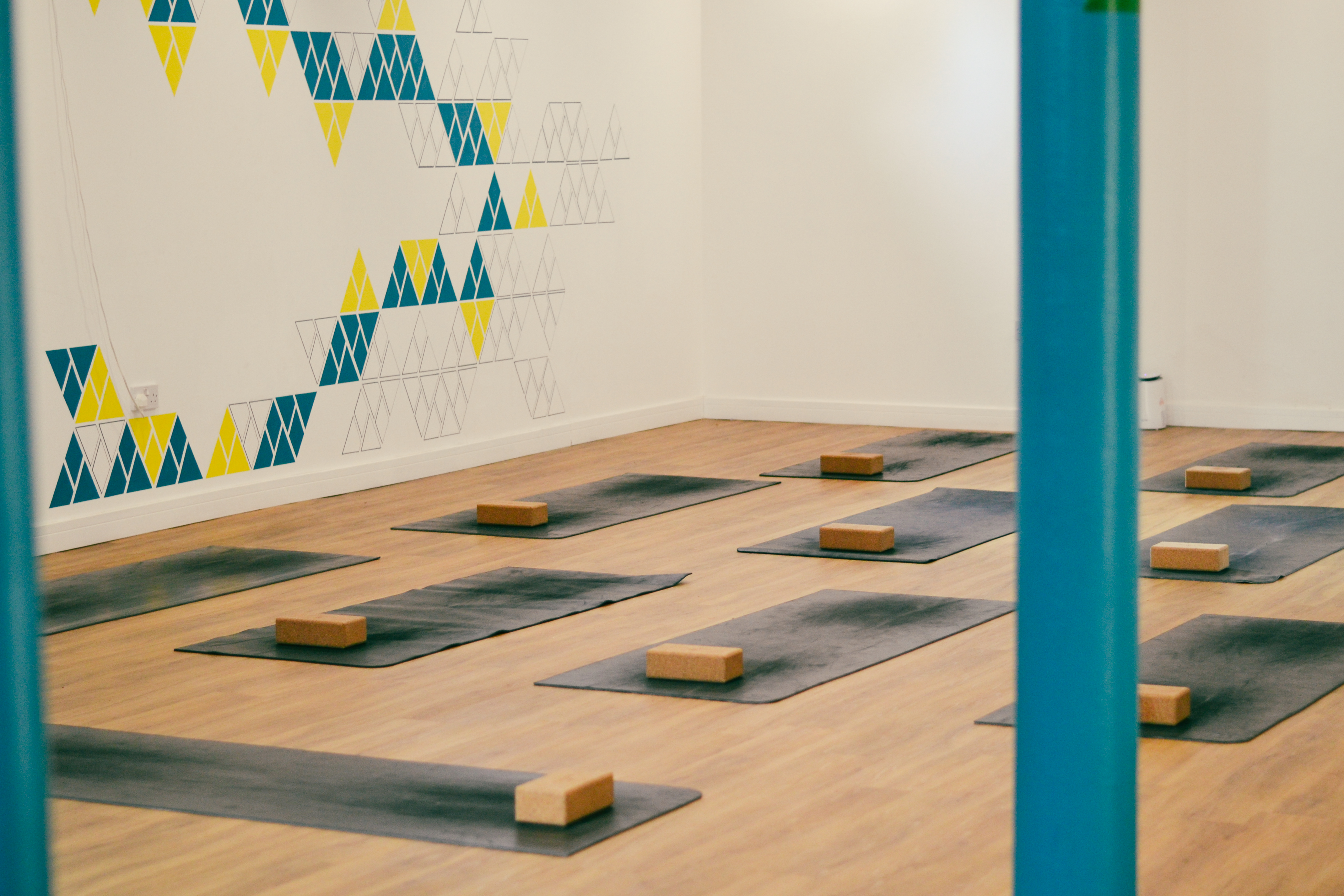 Serene yoga studio with vibrant decor, ideal for wellness retreats and mindfulness workshops.