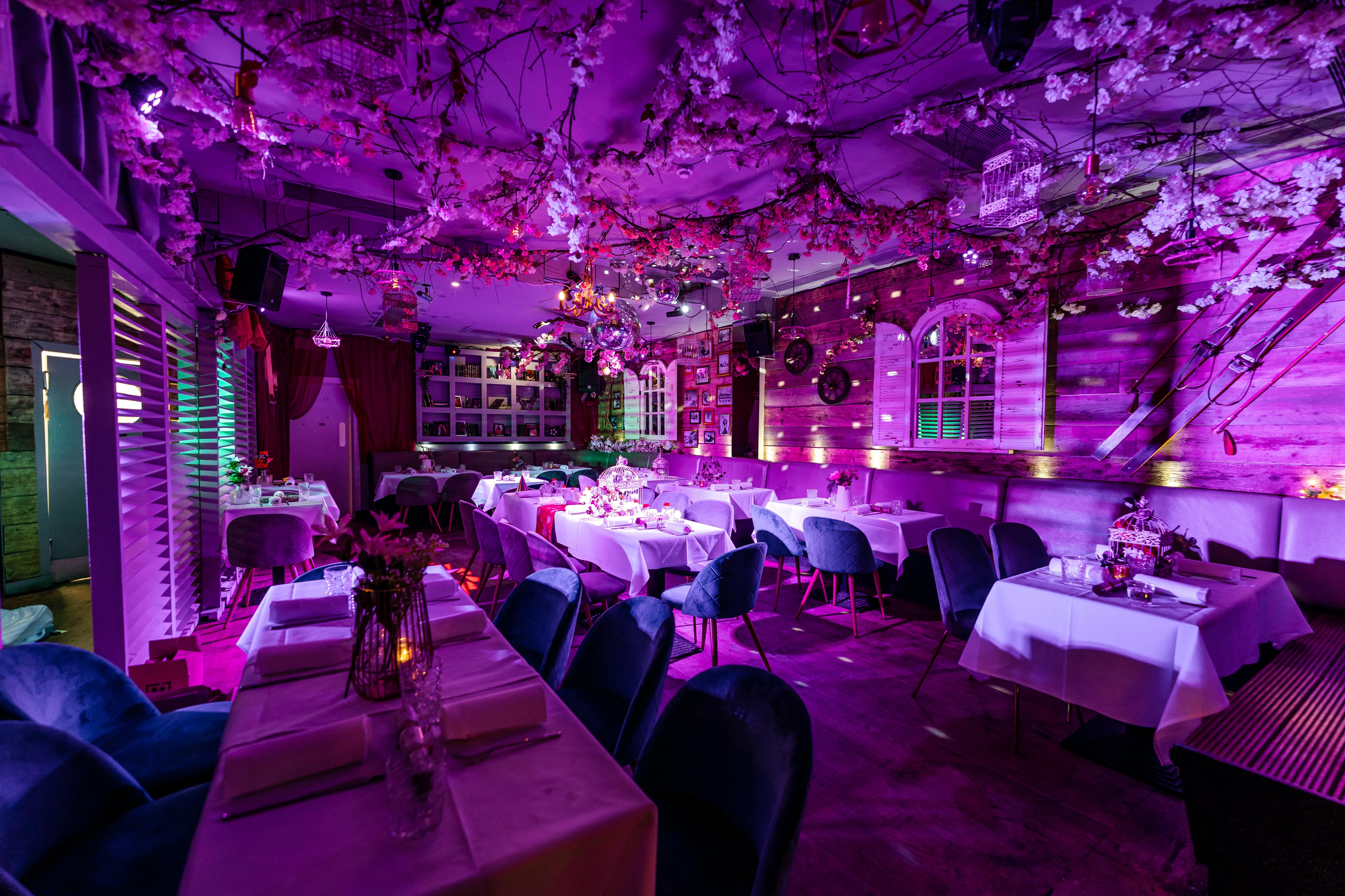 Elegant event space at Chelsea Lodge with pink blossoms, ideal for weddings and celebrations.