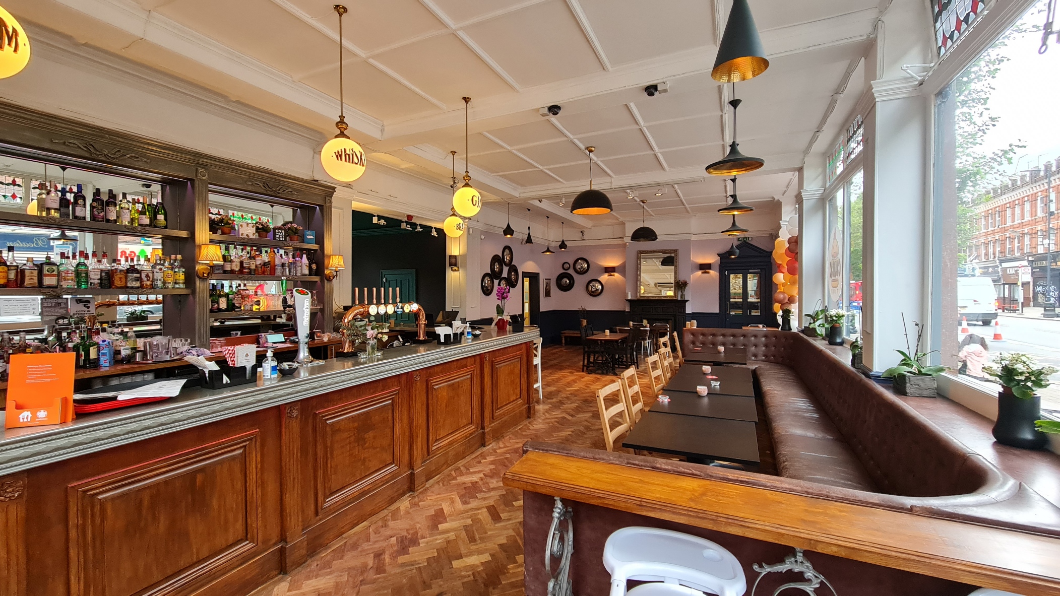 Stylish Windmill Bar with warm lighting, ideal for networking events and celebrations.