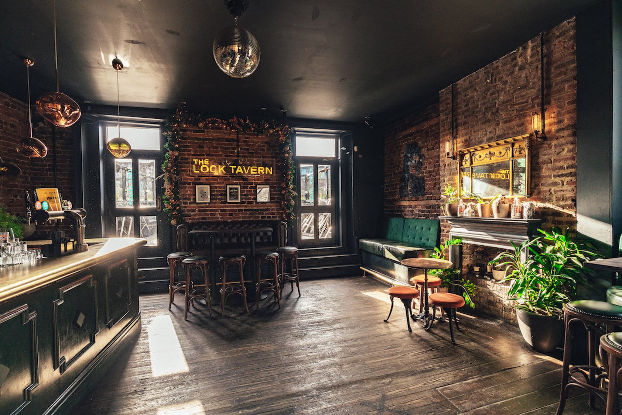 Stylish Cocktail Lounge in Lock Tavern with exposed brick, perfect for gatherings and events.