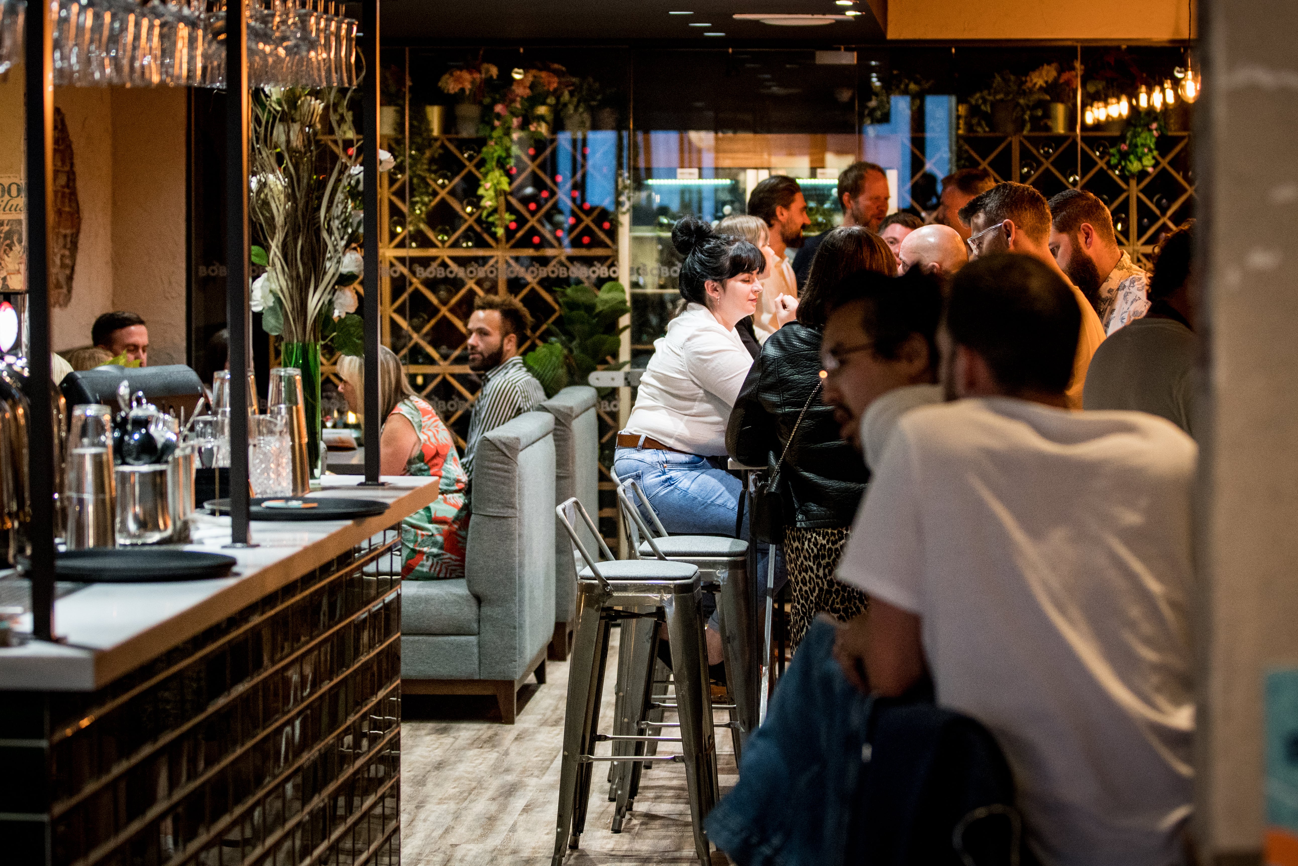 Vibrant BoBo venue with stylish bar, ideal for networking and social gatherings.