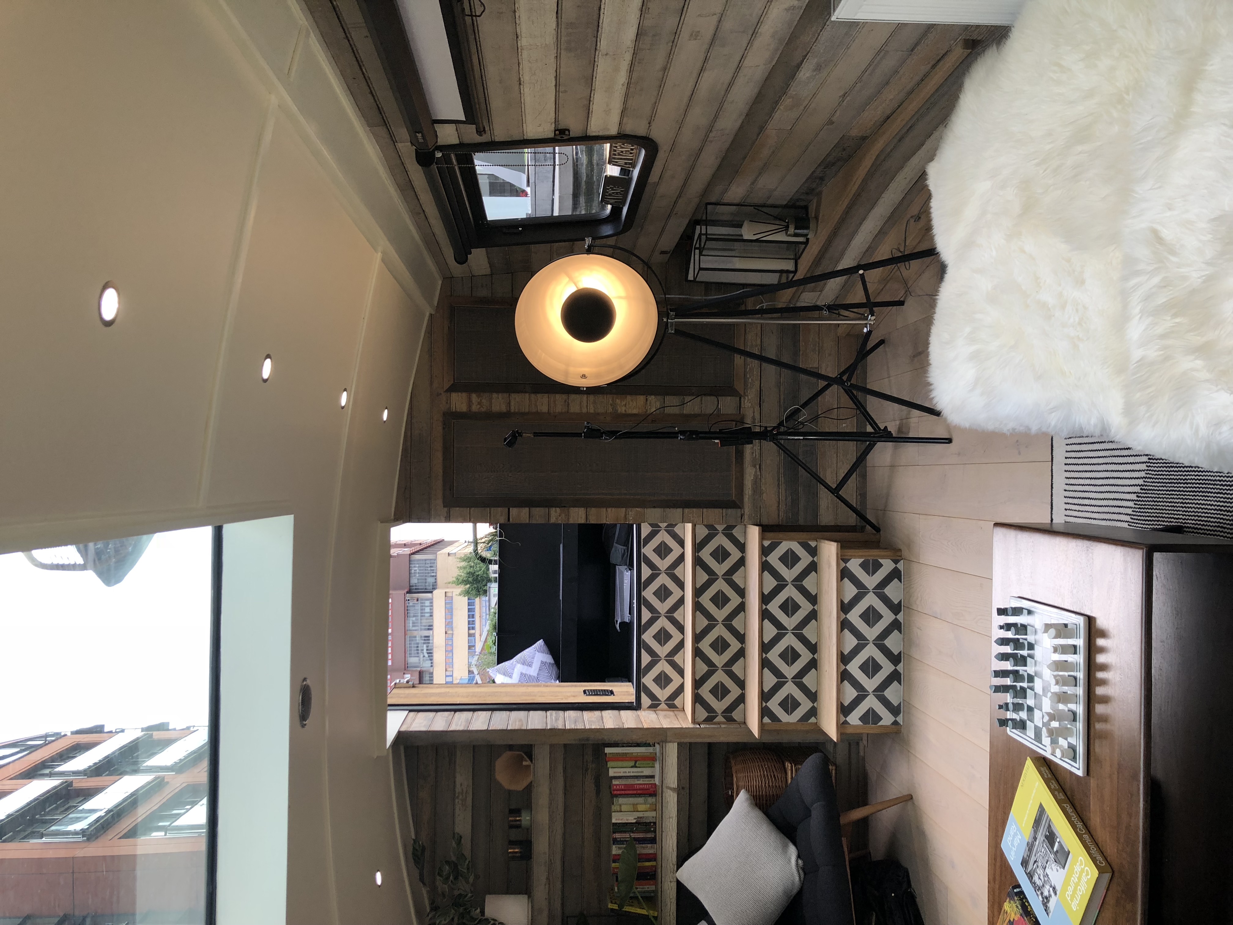 Boutique hotel boat event space with cozy wooden interior in Paddington, London.
