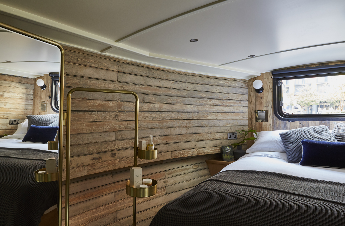 Boutique hotel boat in Paddington, featuring warm wooden walls for retreats and workshops.