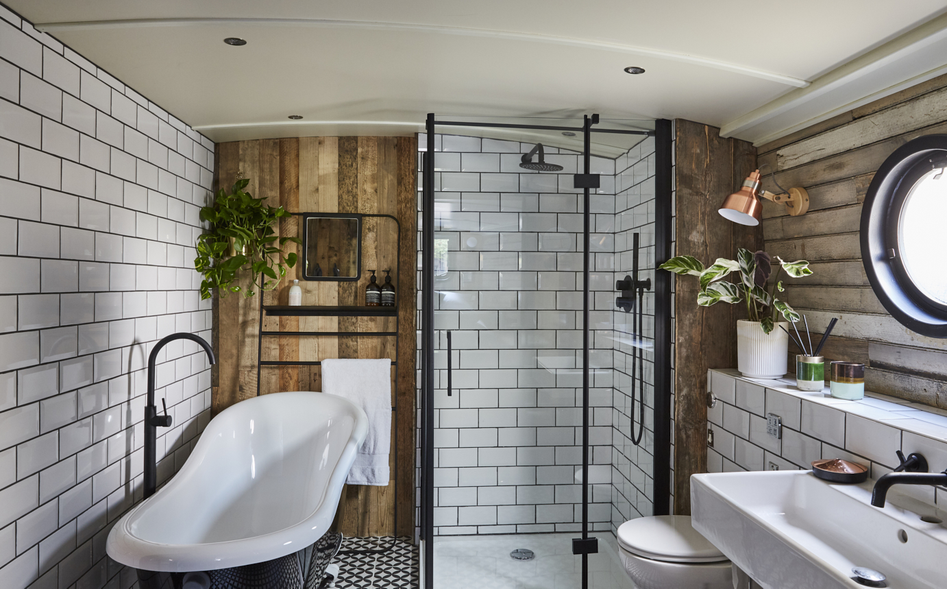 Stylish bathroom with glass shower in Paddington West Boutique Hotel Boat, London events.