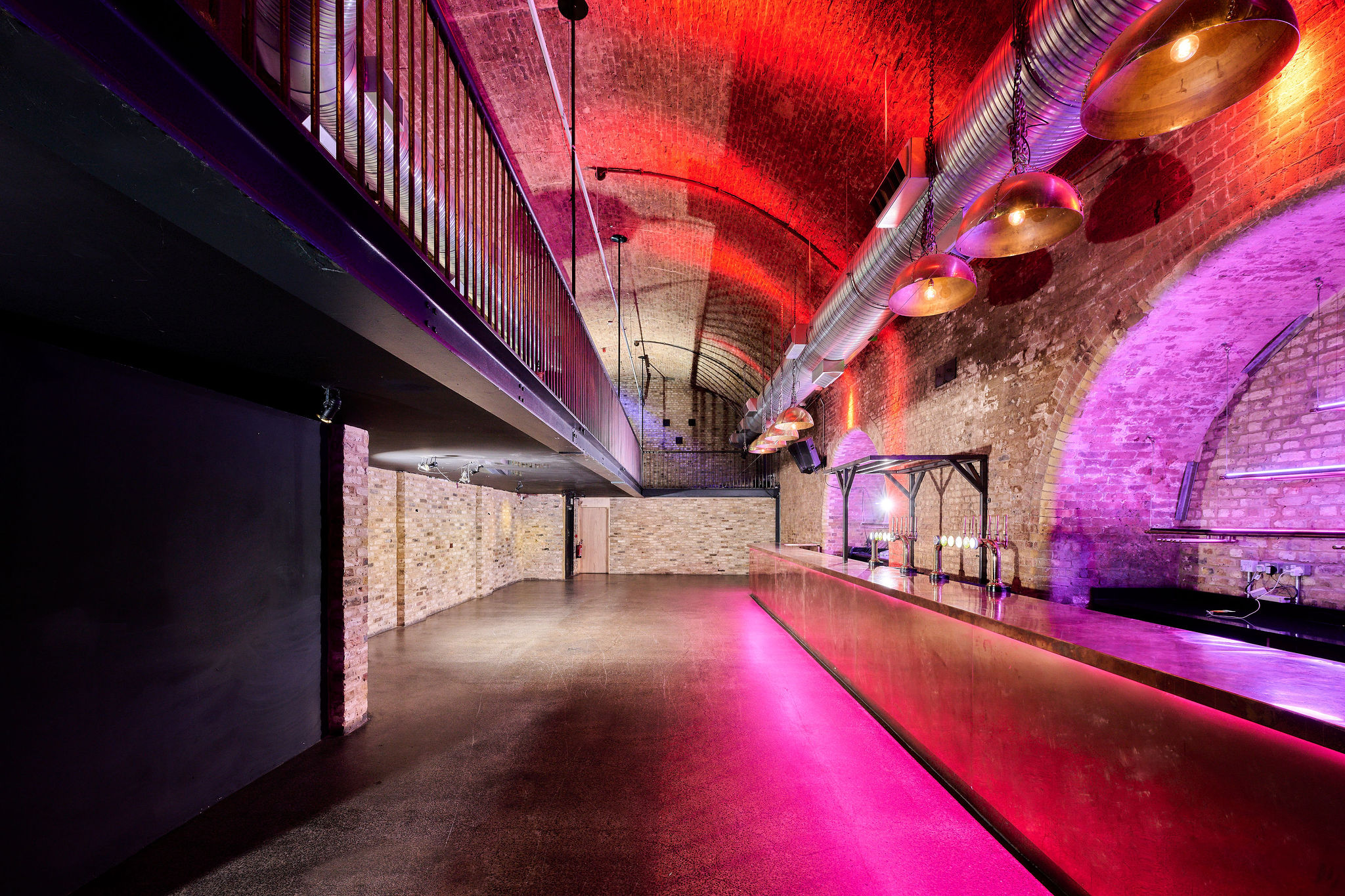 Stylish industrial event space with exposed brick and high ceilings at The Steel Yard.