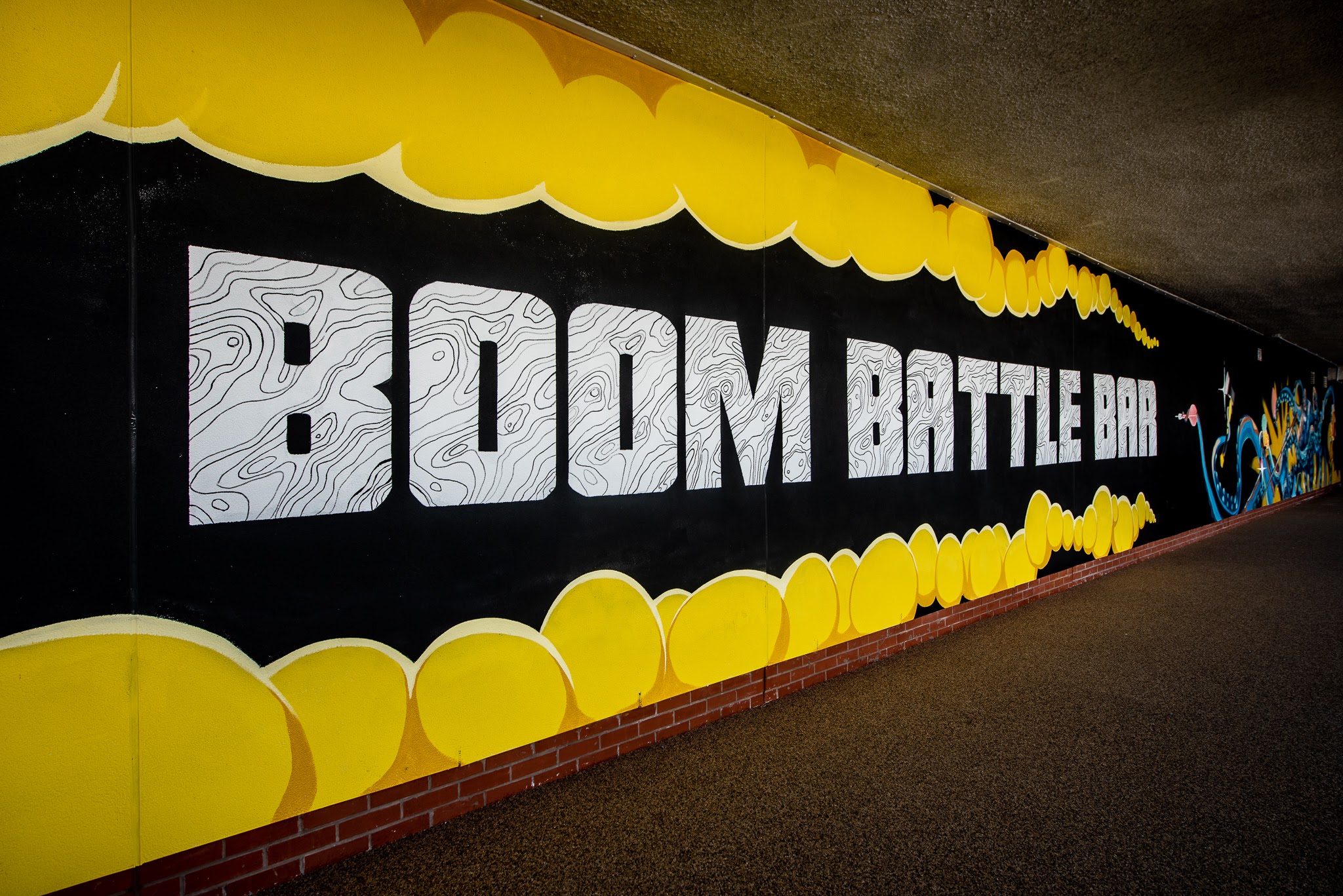 Vibrant mural at Boom Battle Bar, perfect for team-building and social events.