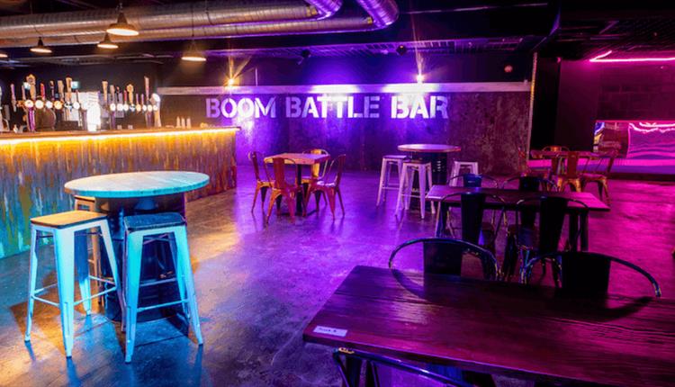 Full Venue Hire at Boom Battle Bar with illuminated bar, ideal for events and gatherings.