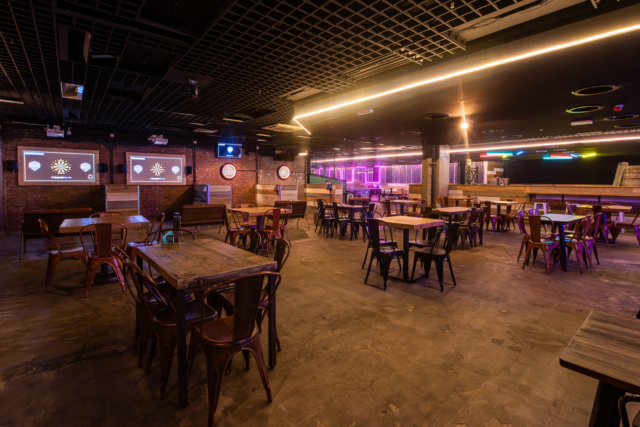 Spacious industrial-chic event venue with exposed brick for corporate events and parties.