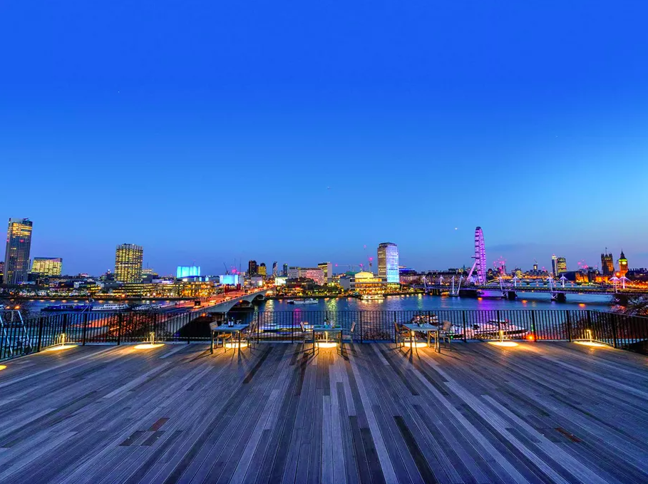 Waterfront London venue, skyline, evening reception, gala.