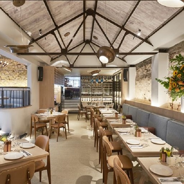 Stylish Meraki London restaurant with wooden beams, perfect for corporate dinners and celebrations.