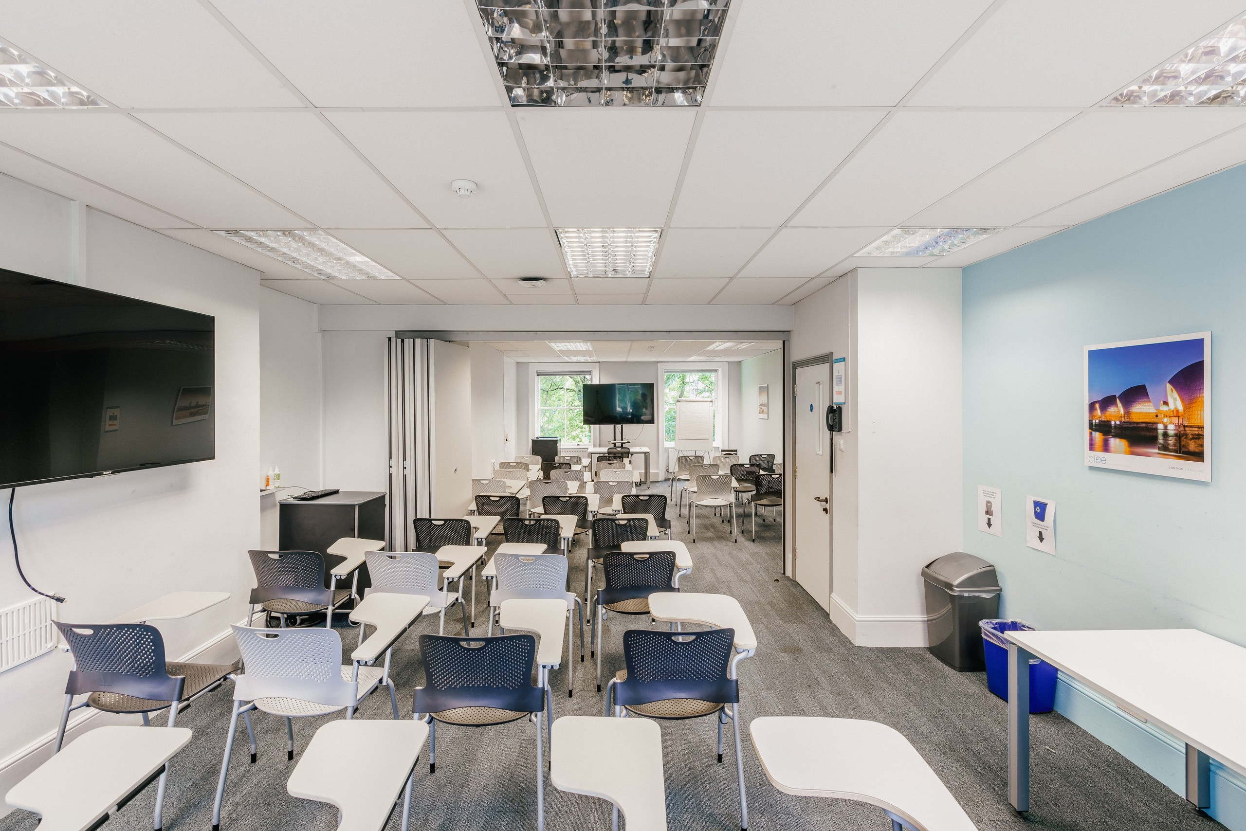 Versatile meeting space in CIEE London with movable furniture for workshops and presentations.