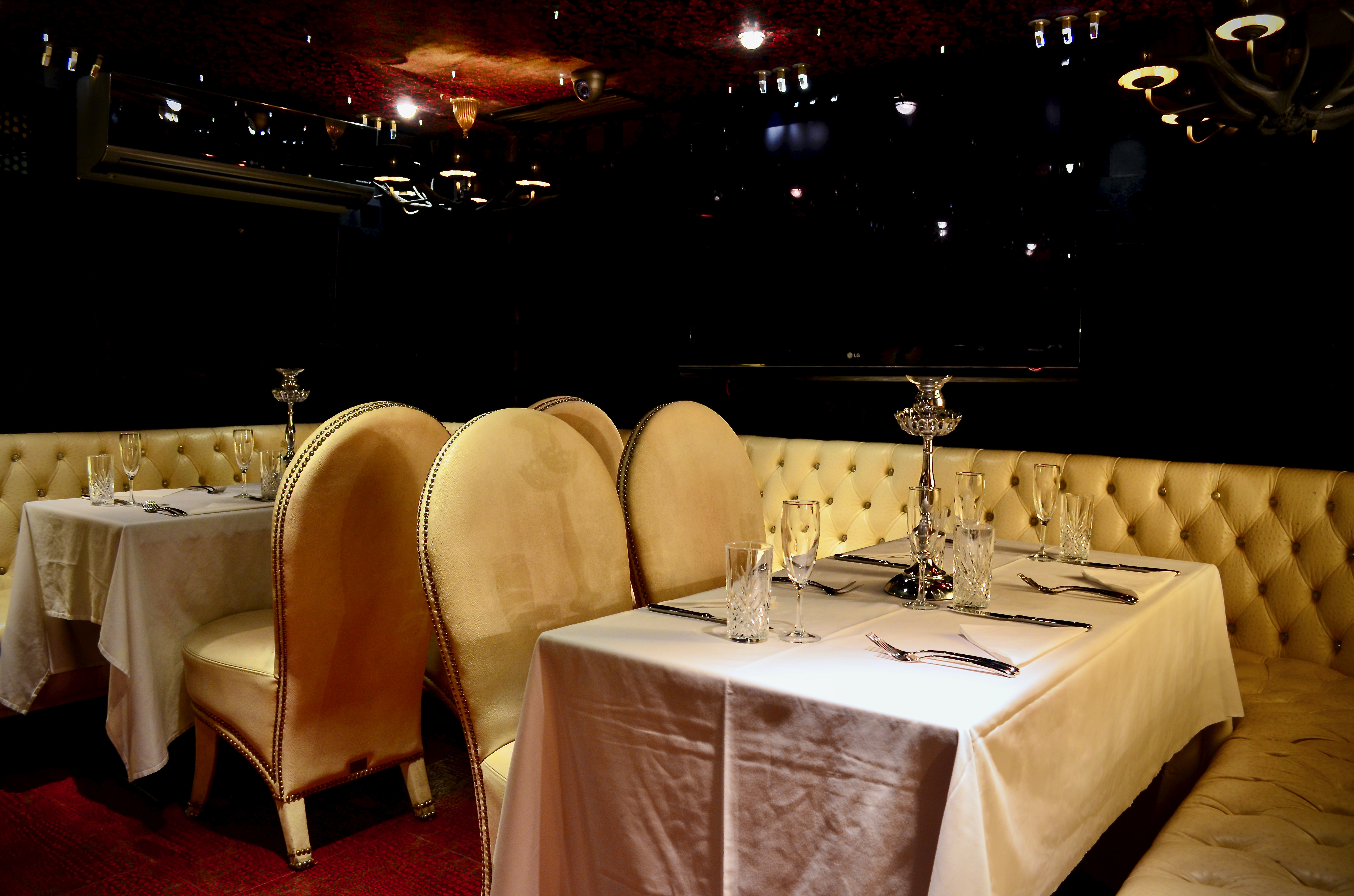 Elegant dining area in The White Room, perfect for upscale events and intimate gatherings.