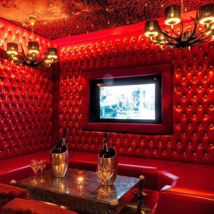 Luxurious Red Room at 1989 Clubhouse, perfect for upscale corporate events and gatherings.