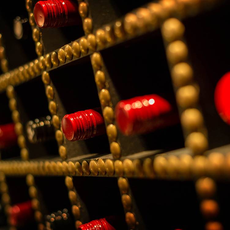 Red Room wine rack at 1989 Clubhouse, perfect for upscale events and gatherings.