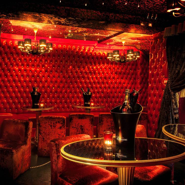 Luxurious Red Room with velvet walls, perfect for upscale events and cocktail parties.