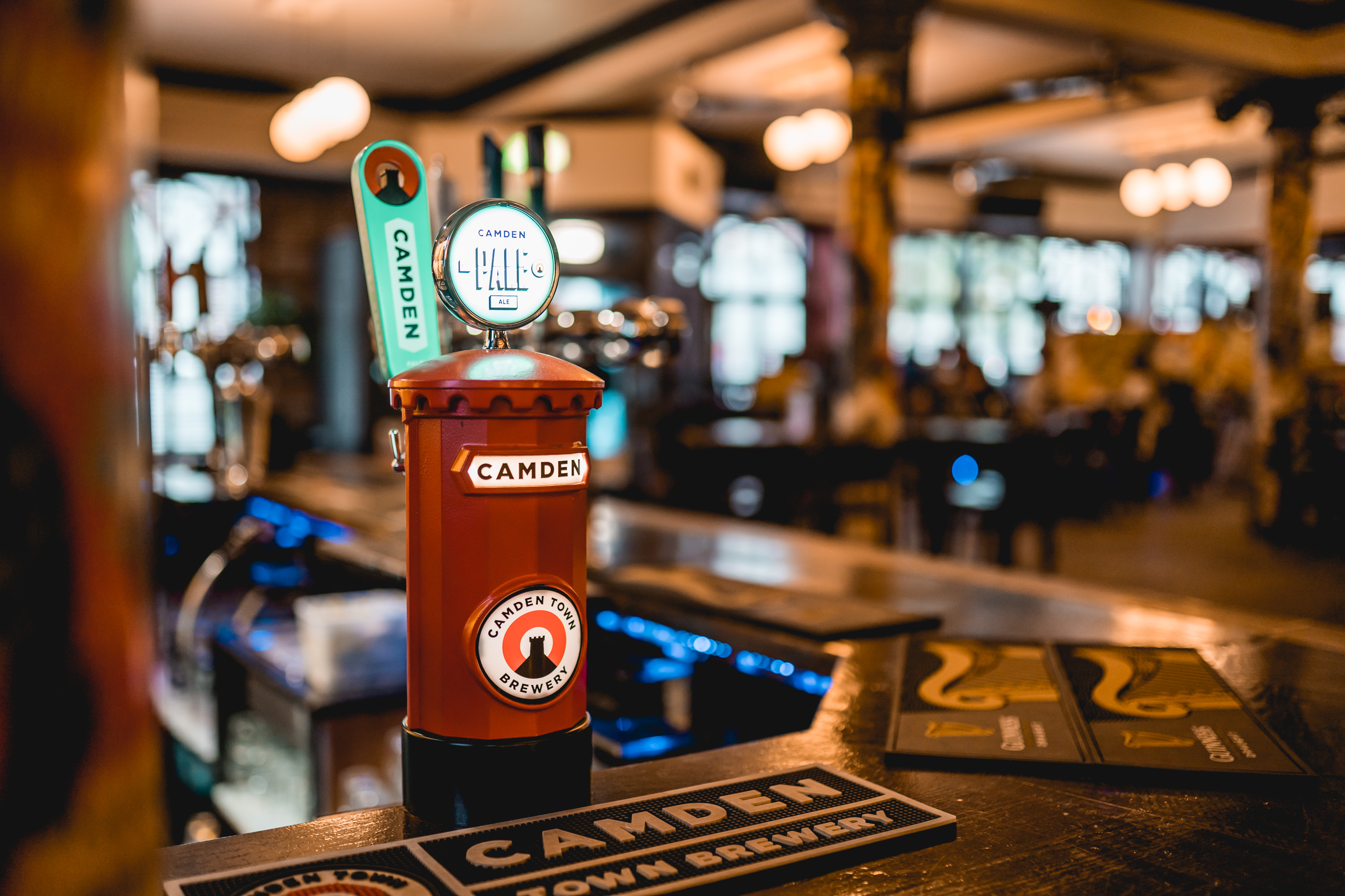 The Prince Of Wales Pub bar with vibrant Camden Brewery tap, perfect for networking events.