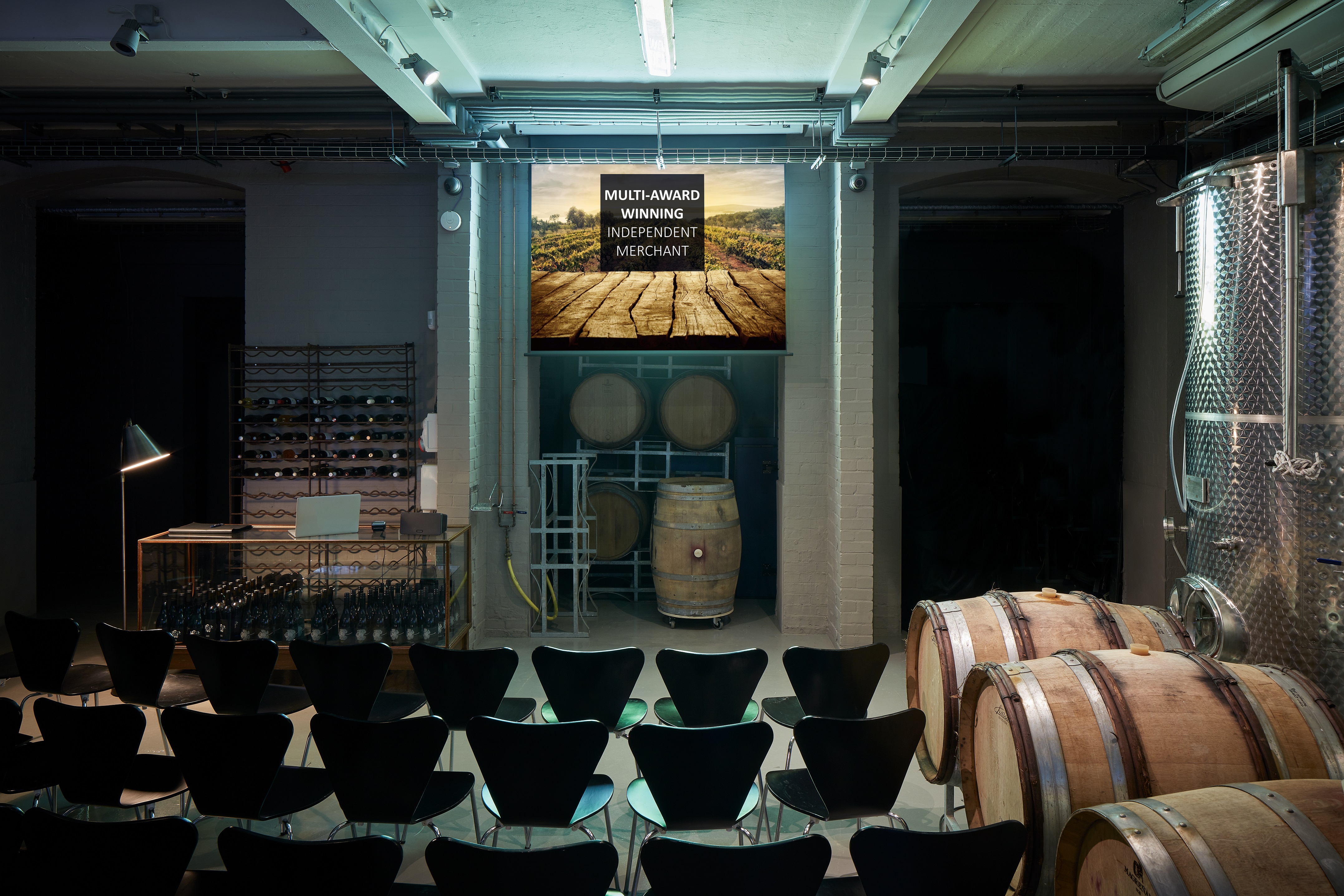 Tank Room at London Cru: rustic venue with barrels for wine tastings and corporate events.