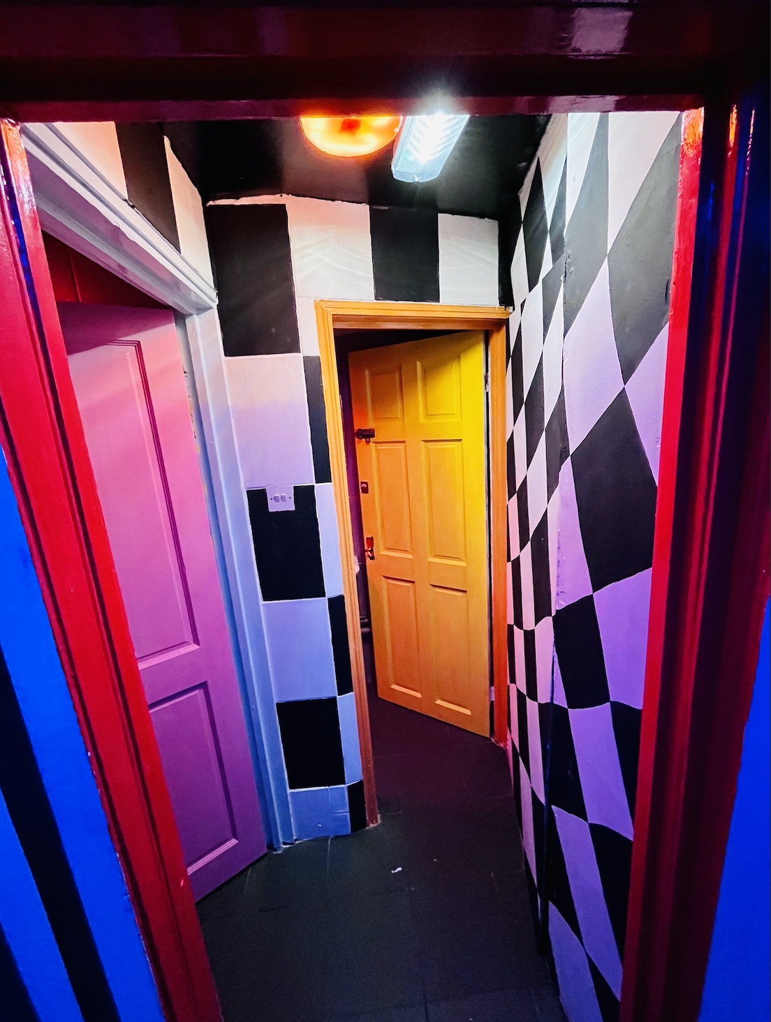 Vibrant checkered hallway at Bonkers Bar, perfect for creative events and brainstorming sessions.