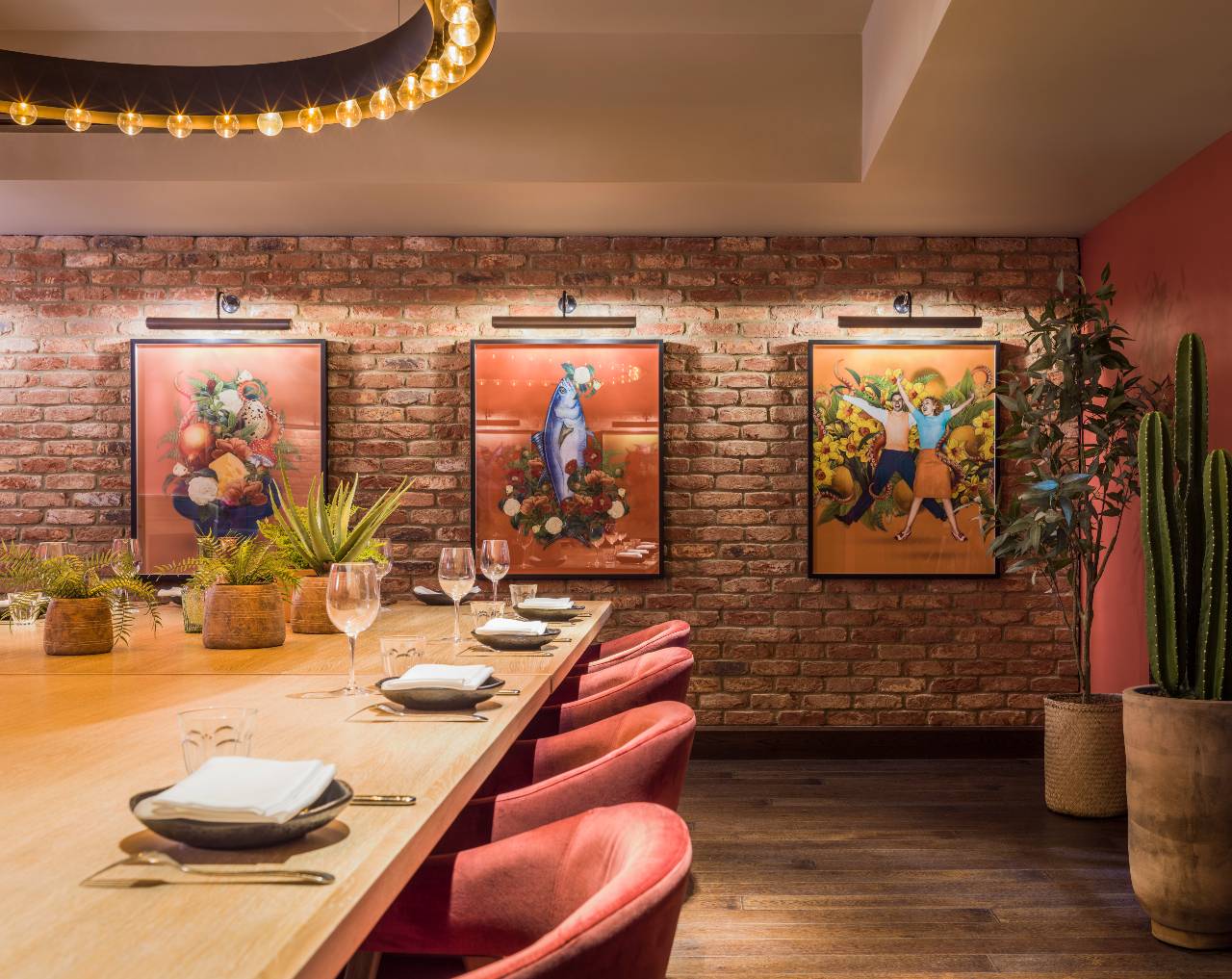 Private dining room at Virgin Hotels London with vibrant artwork, ideal for meetings & events.