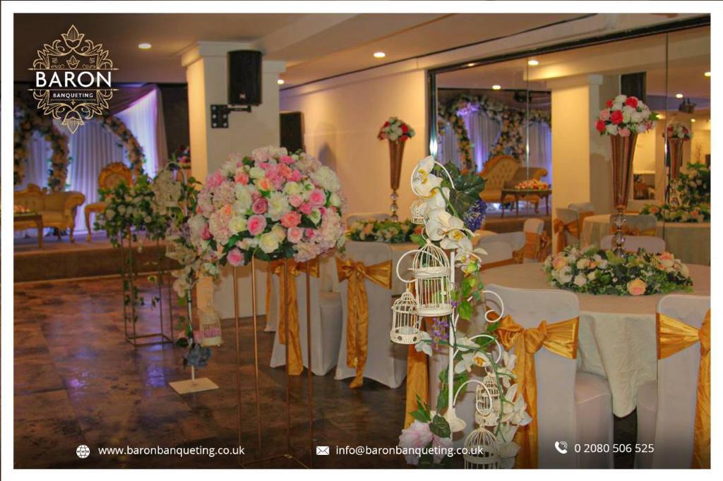 Elegant Baron Lounge event space with floral centerpieces, perfect for weddings and gatherings.