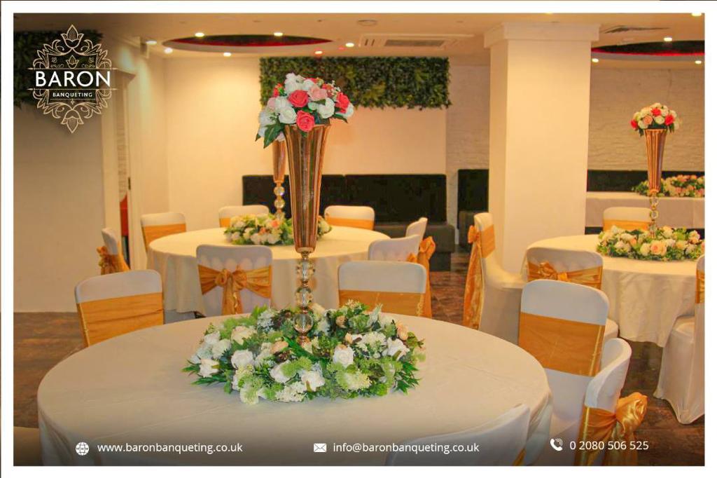 Elegant Baron Lounge event space with round tables, ideal for weddings and corporate events.