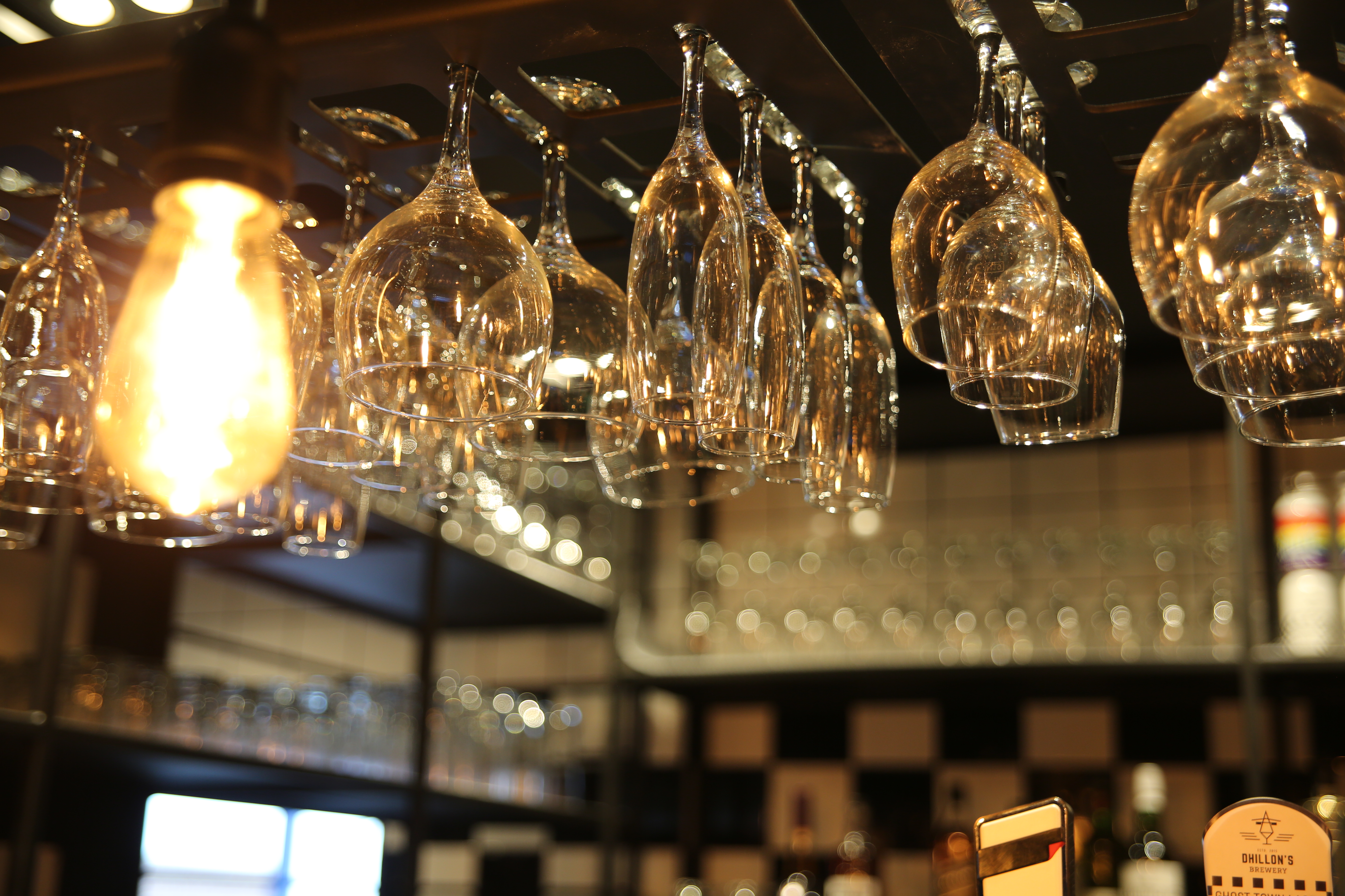 Stylish bar setup with elegant glassware in Sky Blue Tavern for networking events.