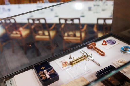 Vintage ENT tools in elegant meeting room at 1 Wimpole Street for networking events.