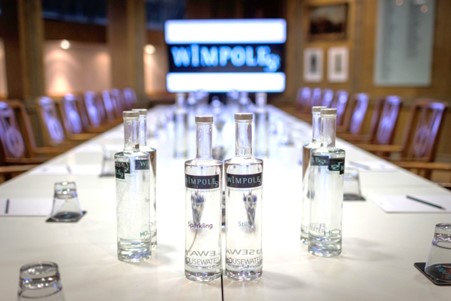 ENT meeting room with long table, digital screen for professional presentations.