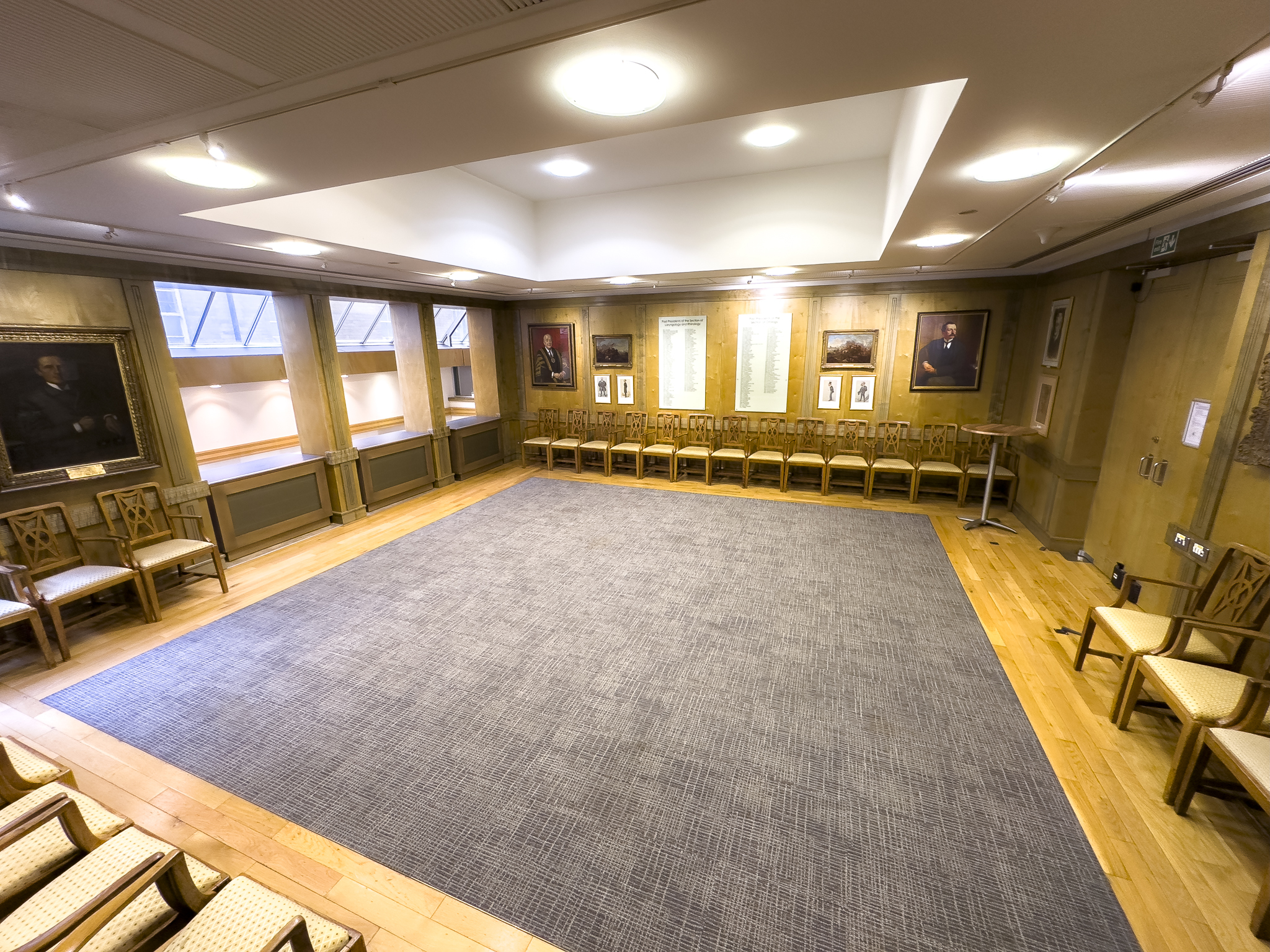 Versatile ENT meeting room with natural light, perfect for workshops and presentations.