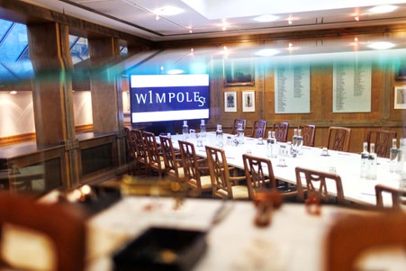 ENT meeting room at 1 Wimpole Street, featuring a long table and branding screen.