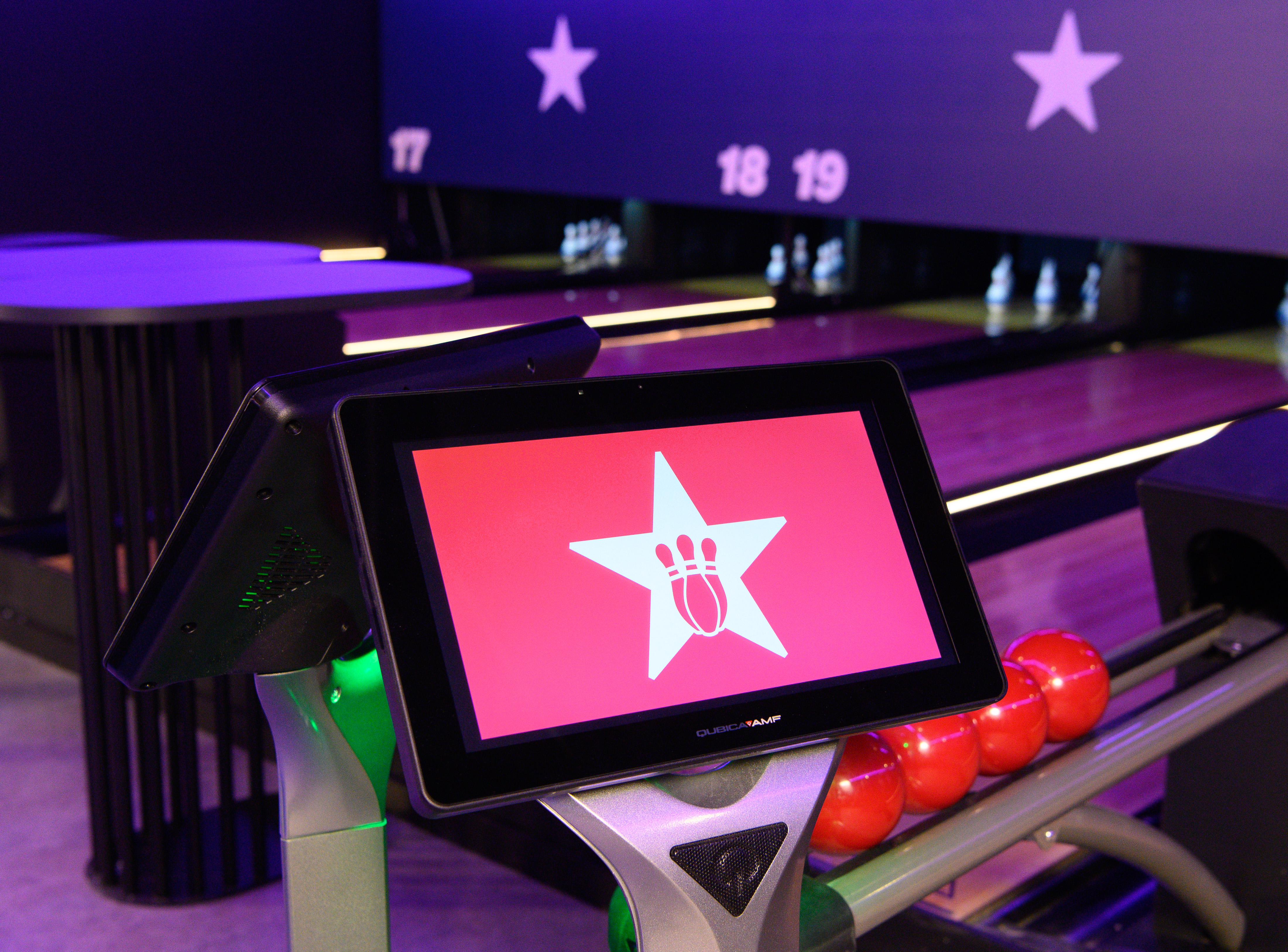 Modern Duckpin Lounge bowling alley with digital scoring, perfect for events and gatherings.