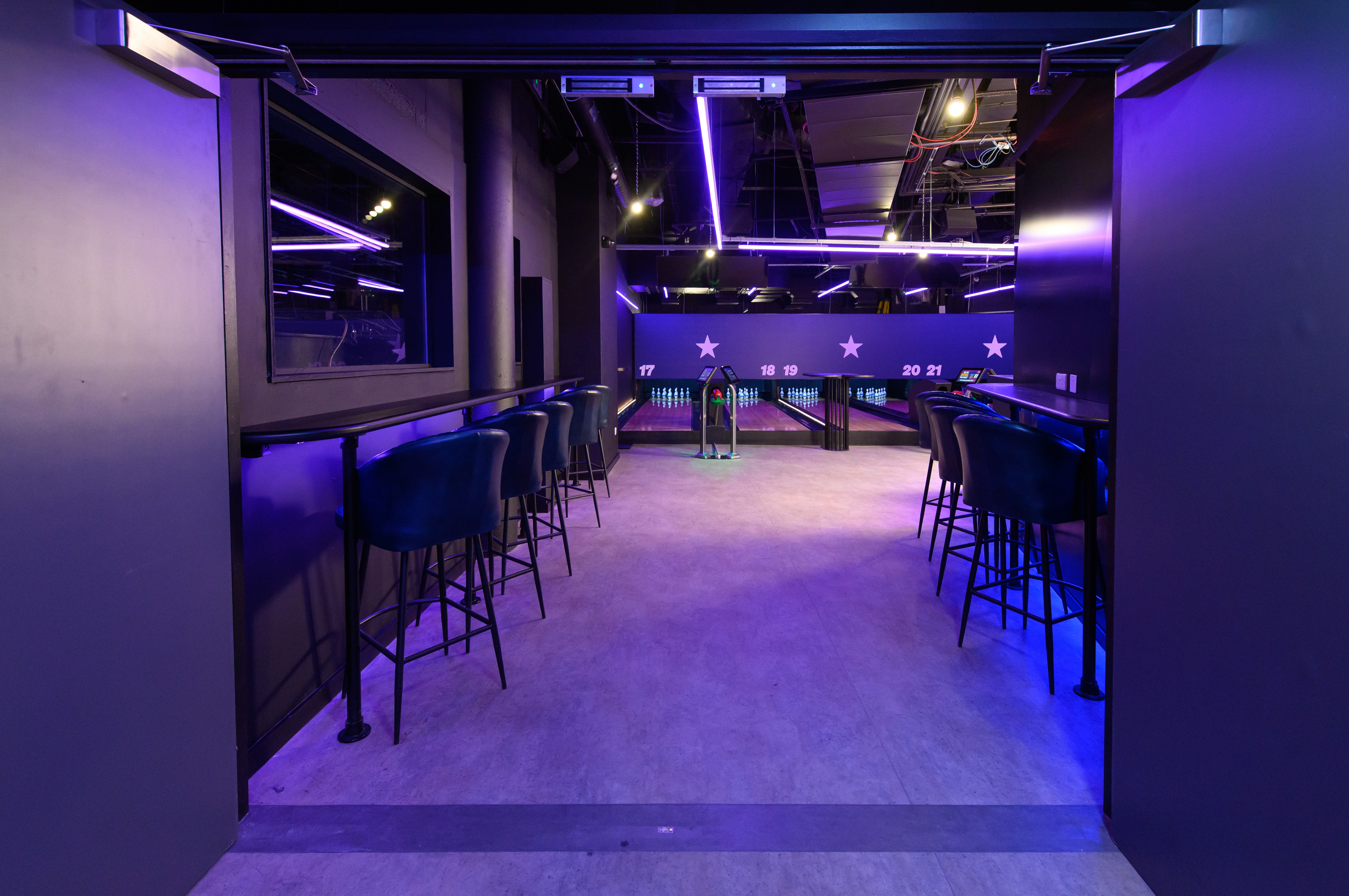 Duckpin Lounge at O2 London: modern event space with vibrant lighting for networking events.