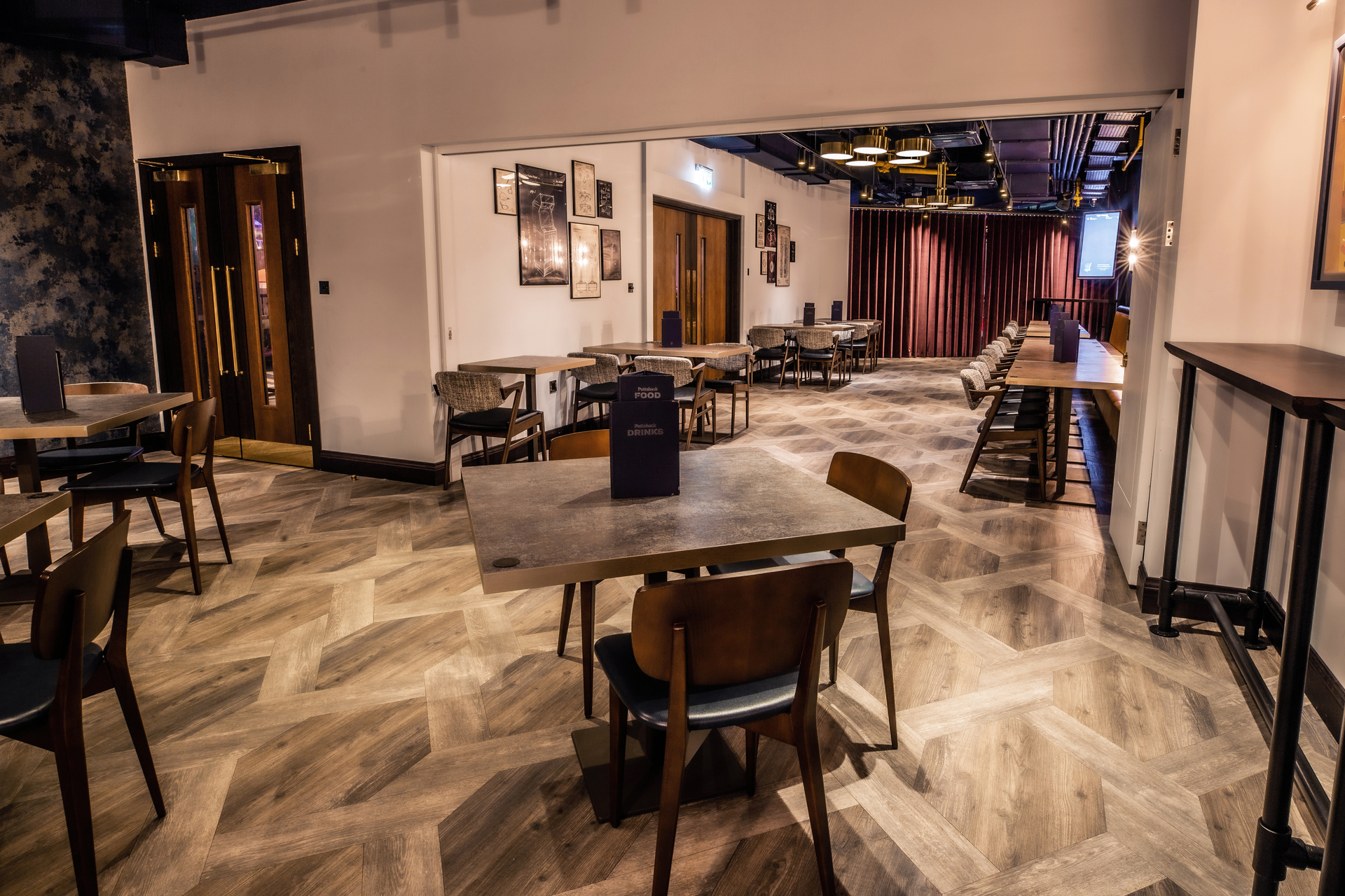 Modern event space at Puttshack Watford, perfect for meetings and gatherings.