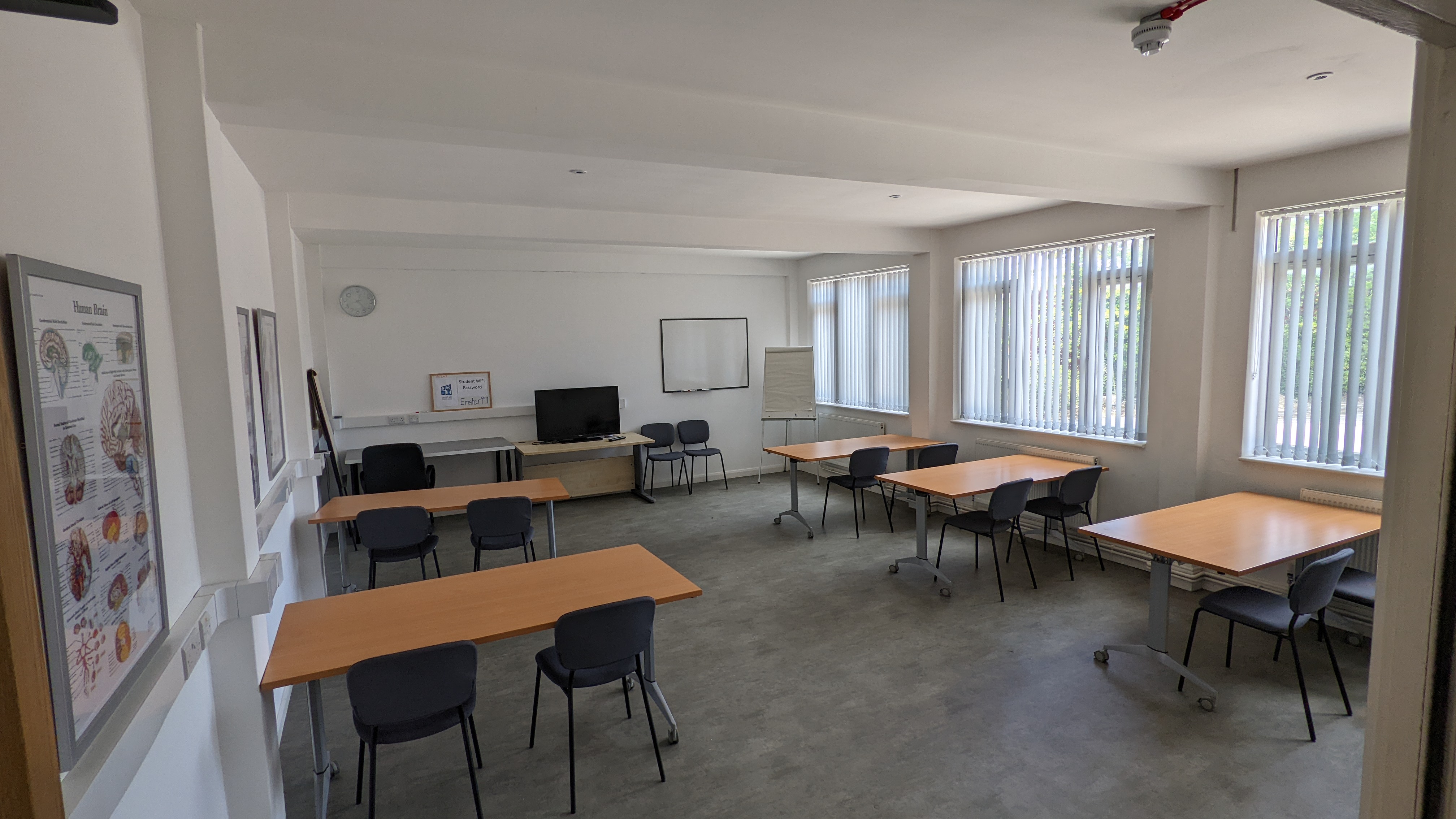 Versatile Gatwick meeting room with natural light, ideal for workshops and conferences.