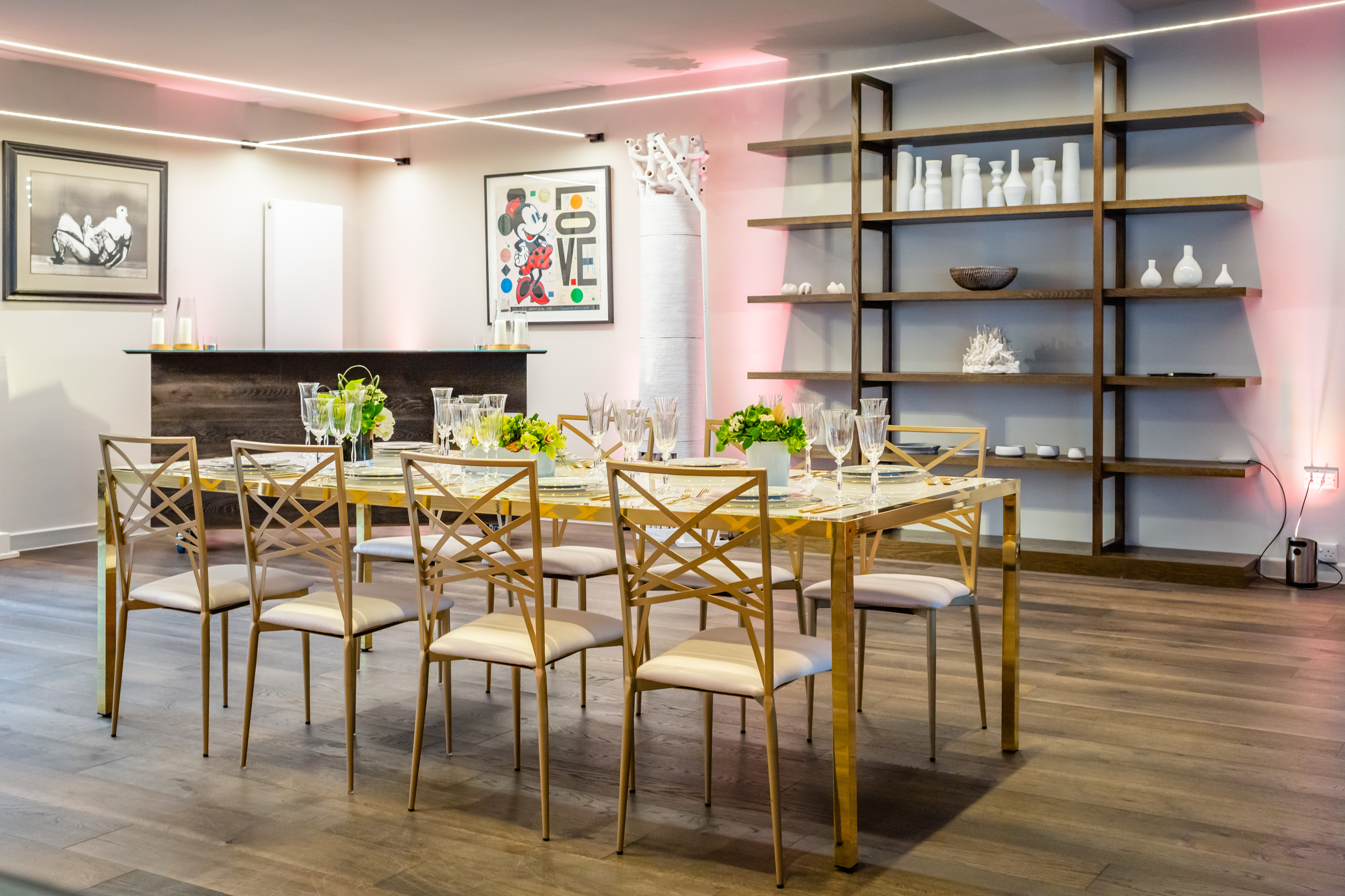 Elegant meeting space with long dining table, ideal for networking events.