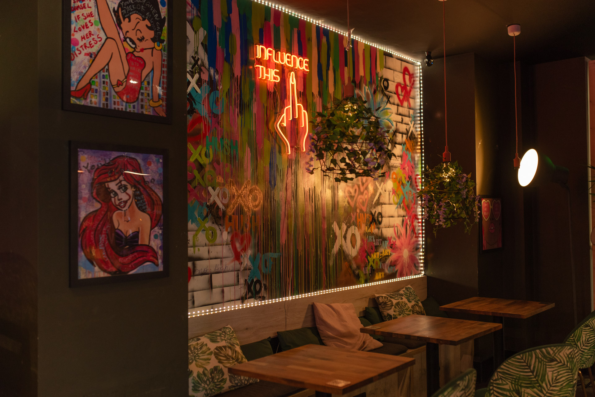 Vibrant venue with neon sign, ideal for creative meetings and networking events.