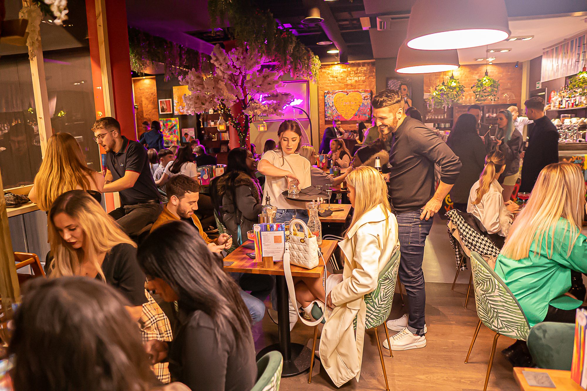 Vibrant venue for social gatherings with colorful decor and cozy seating.