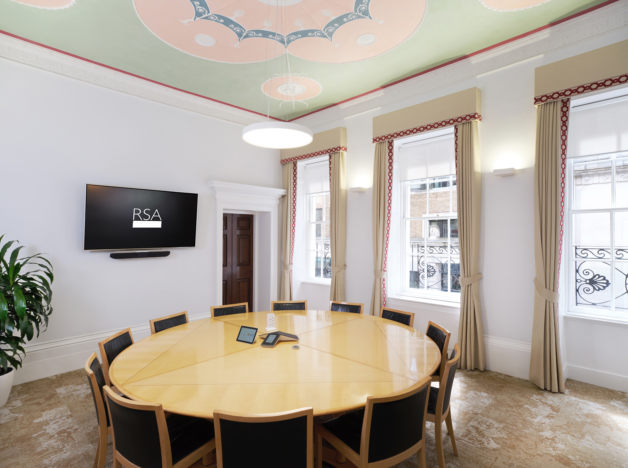 The Shipley Room at RSA House: elegant meeting space with round table for presentations.