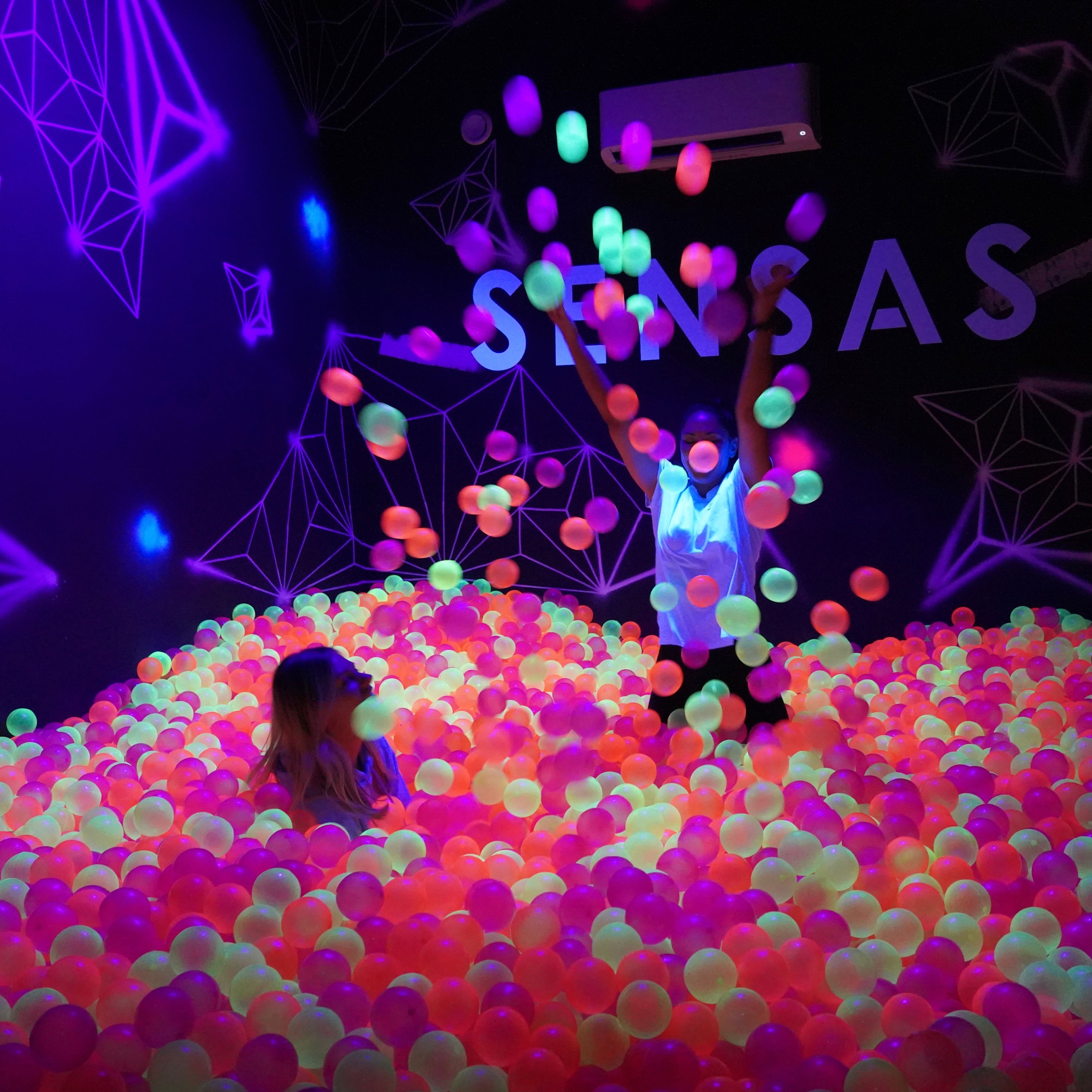 Colorful ball pit at SENSAS London for engaging team-building events and immersive experiences.