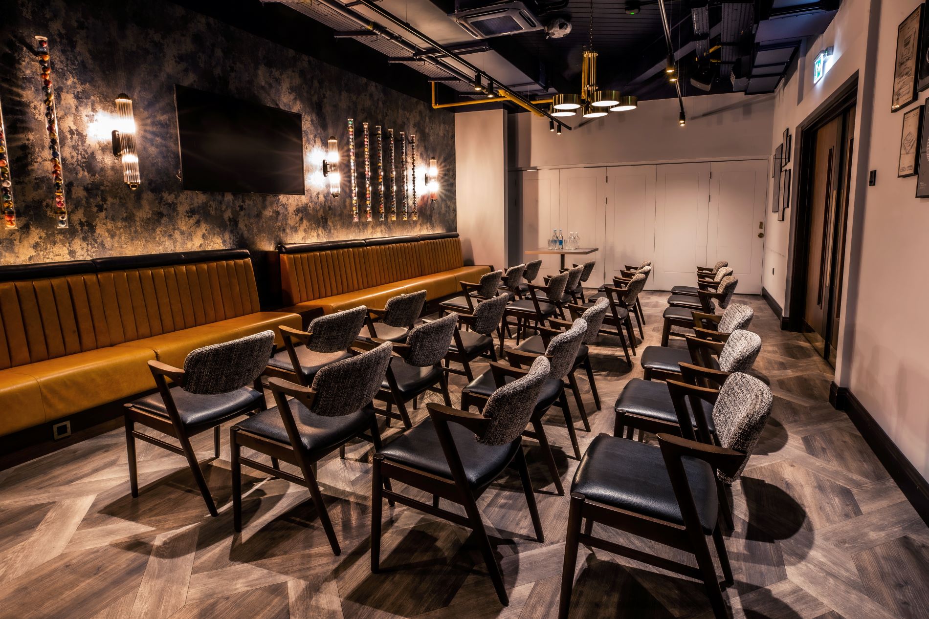 Emerald Private Room at Puttshack Watford, modern meeting space for workshops and presentations.