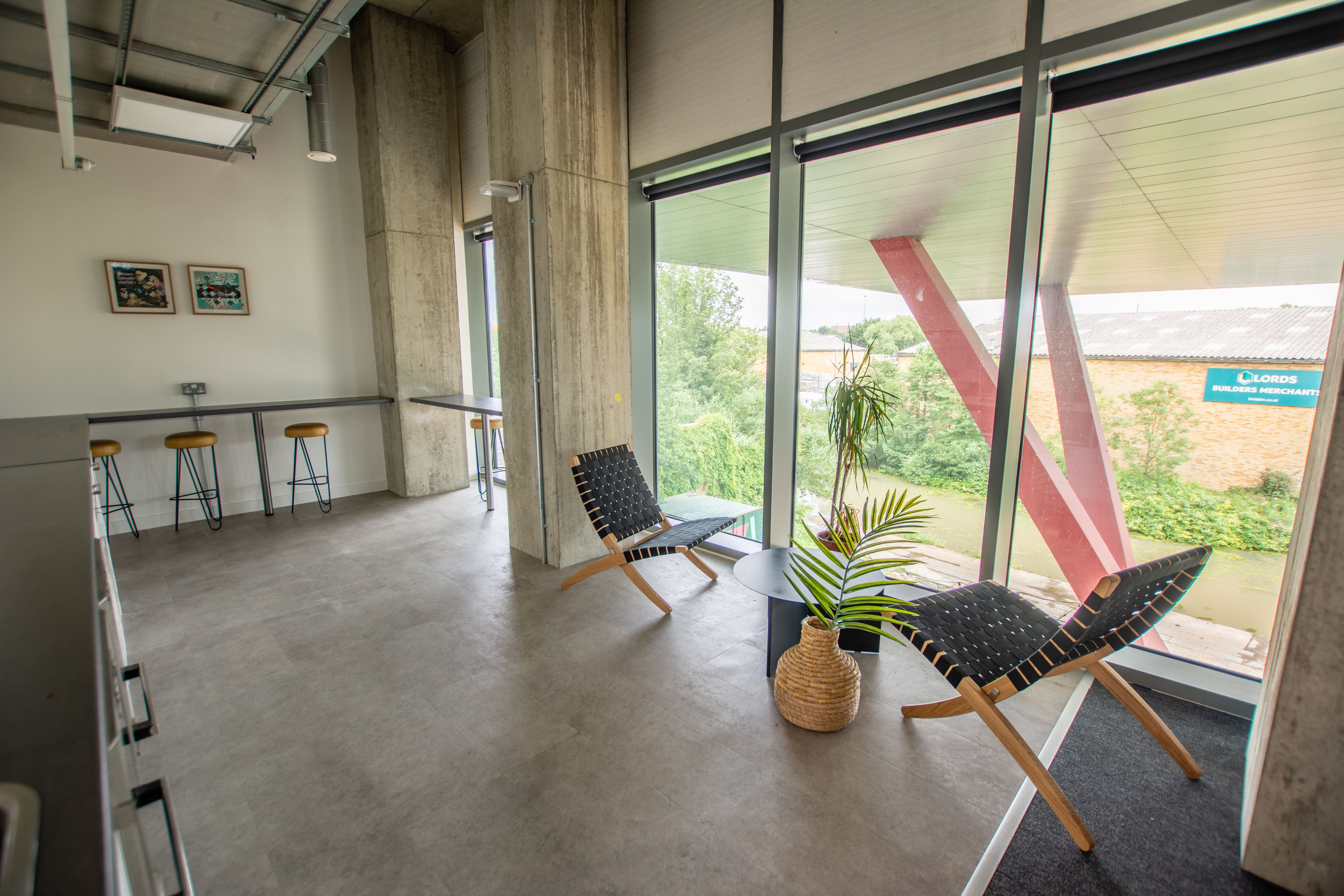 Modern minimalist meeting space with large windows for creative brainstorming sessions.