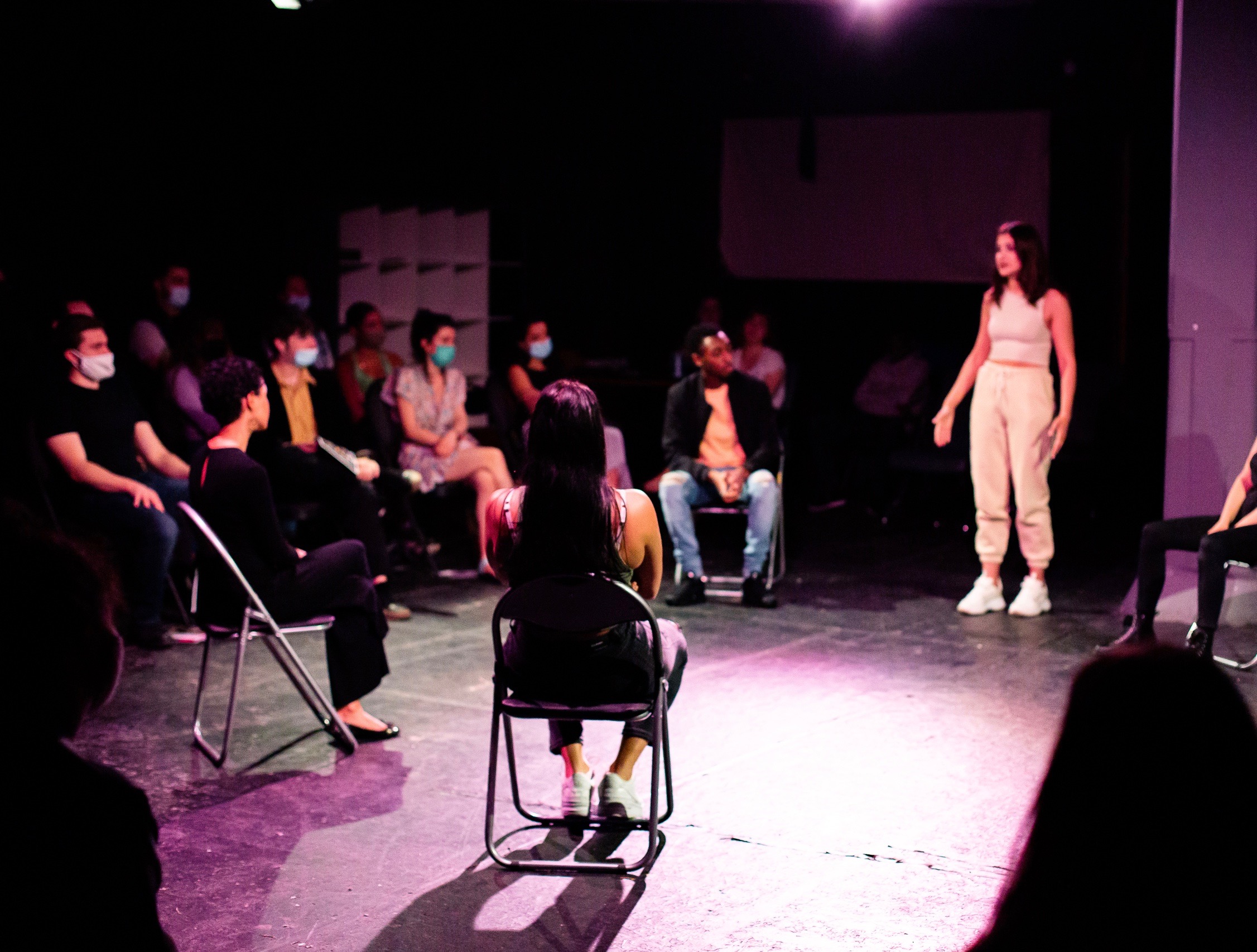 "McQueens Theatre performance with audience in masks for interactive workshops and events."