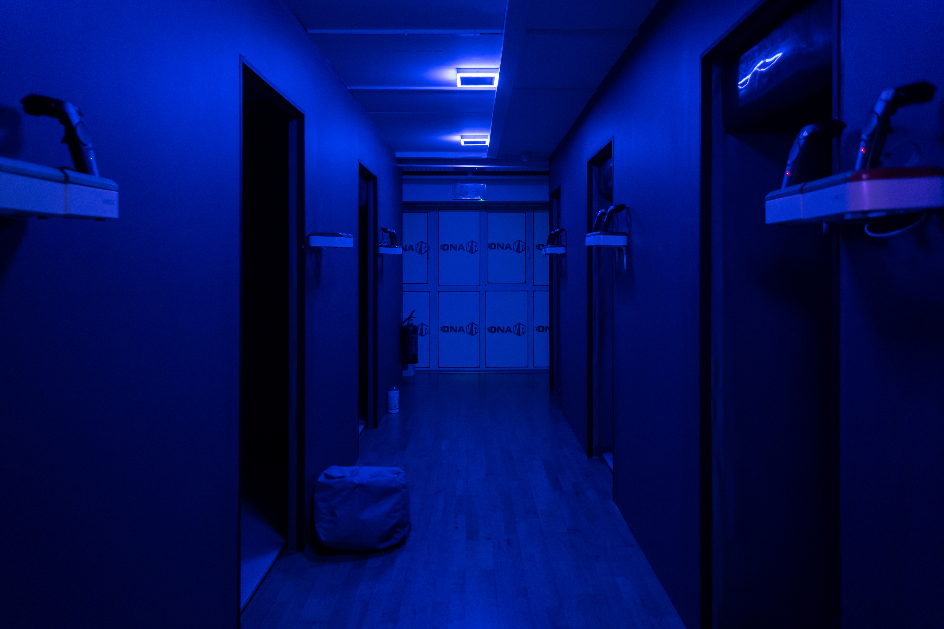 DNA VR Camden arcade corridor with blue walls, ideal for immersive events and themed sessions.