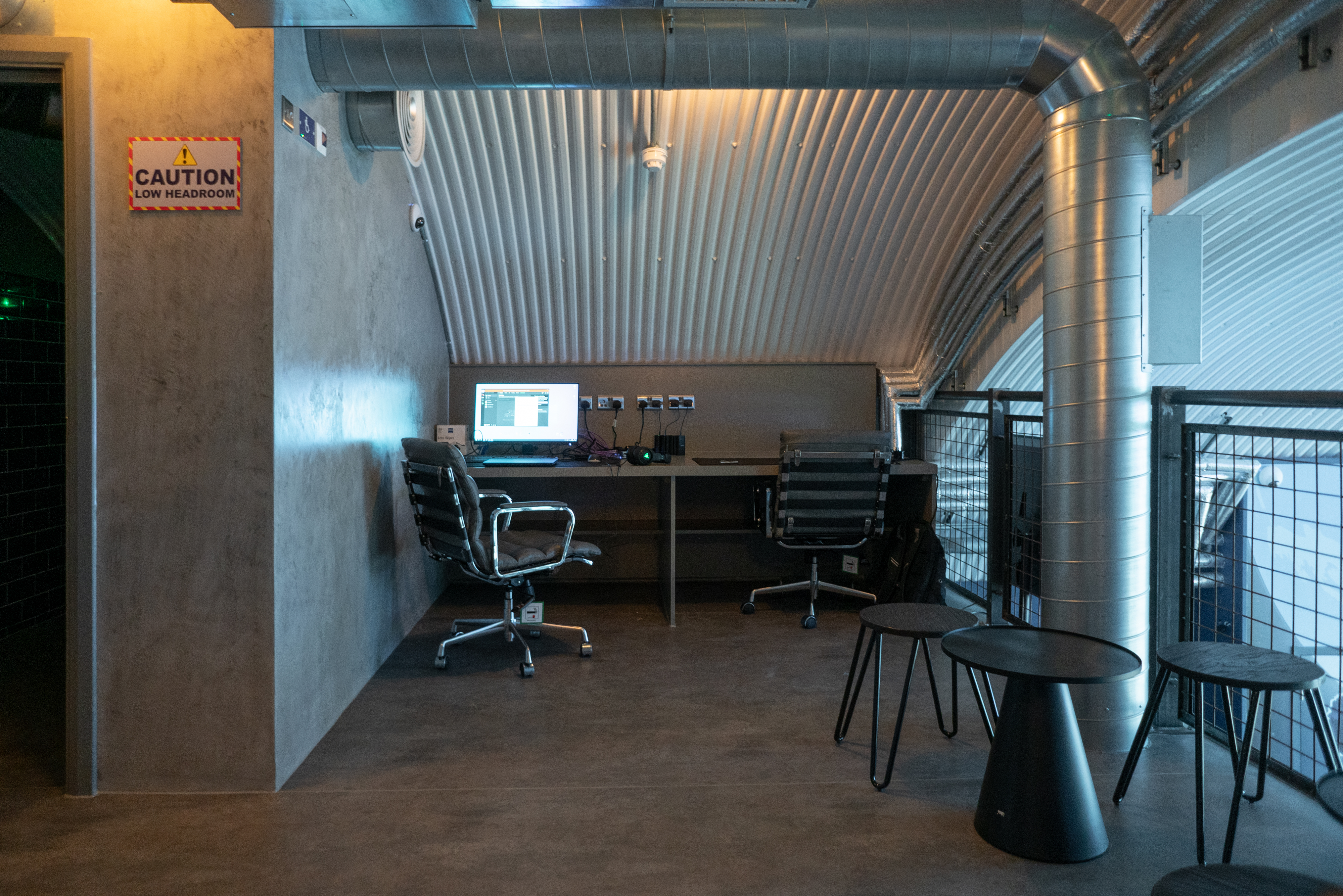 DNA VR Battersea Power Station: modern workspace with sleek chairs for events and meetings.