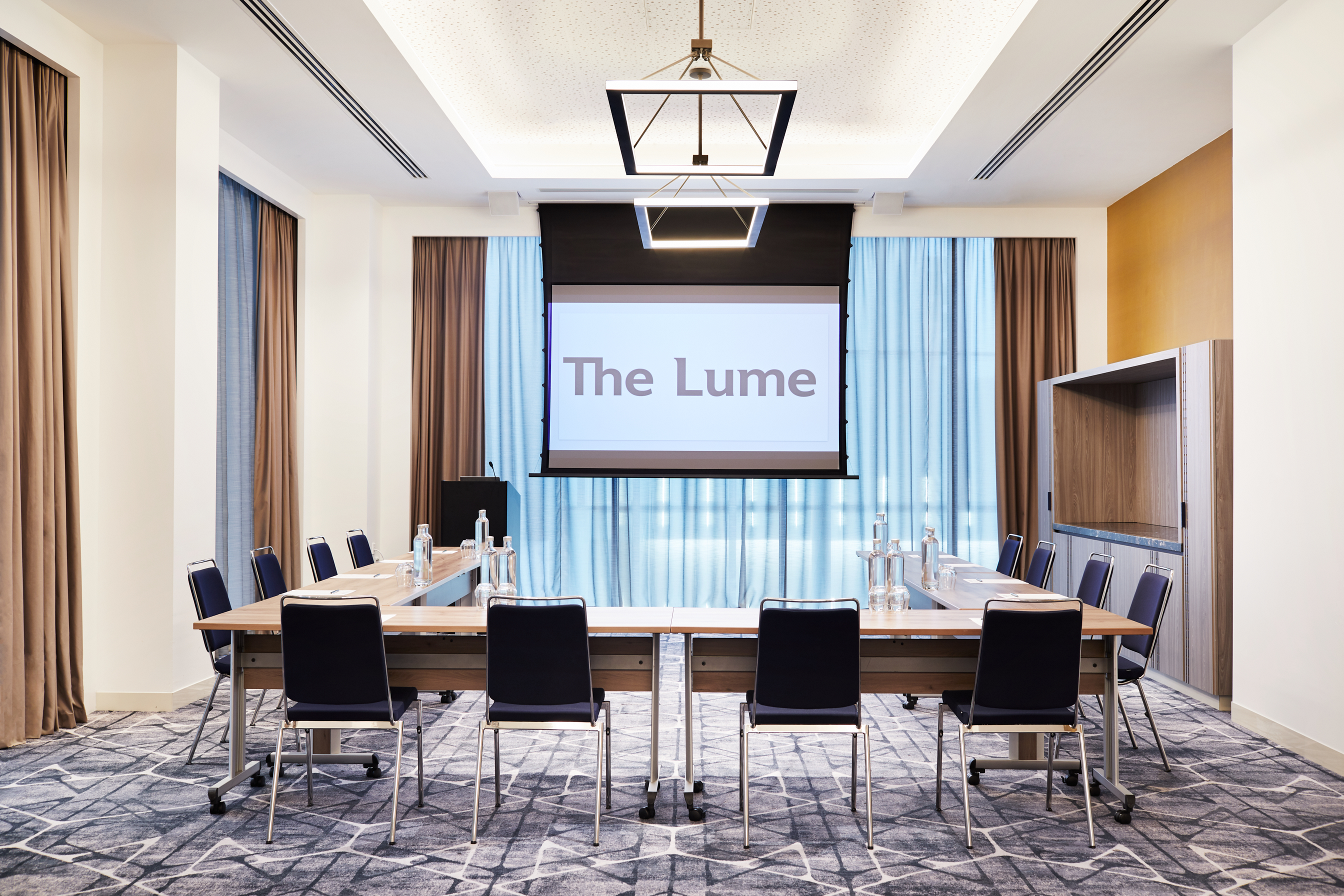 Modern meeting room in Hyatt Regency Manchester, featuring a large table for conferences.