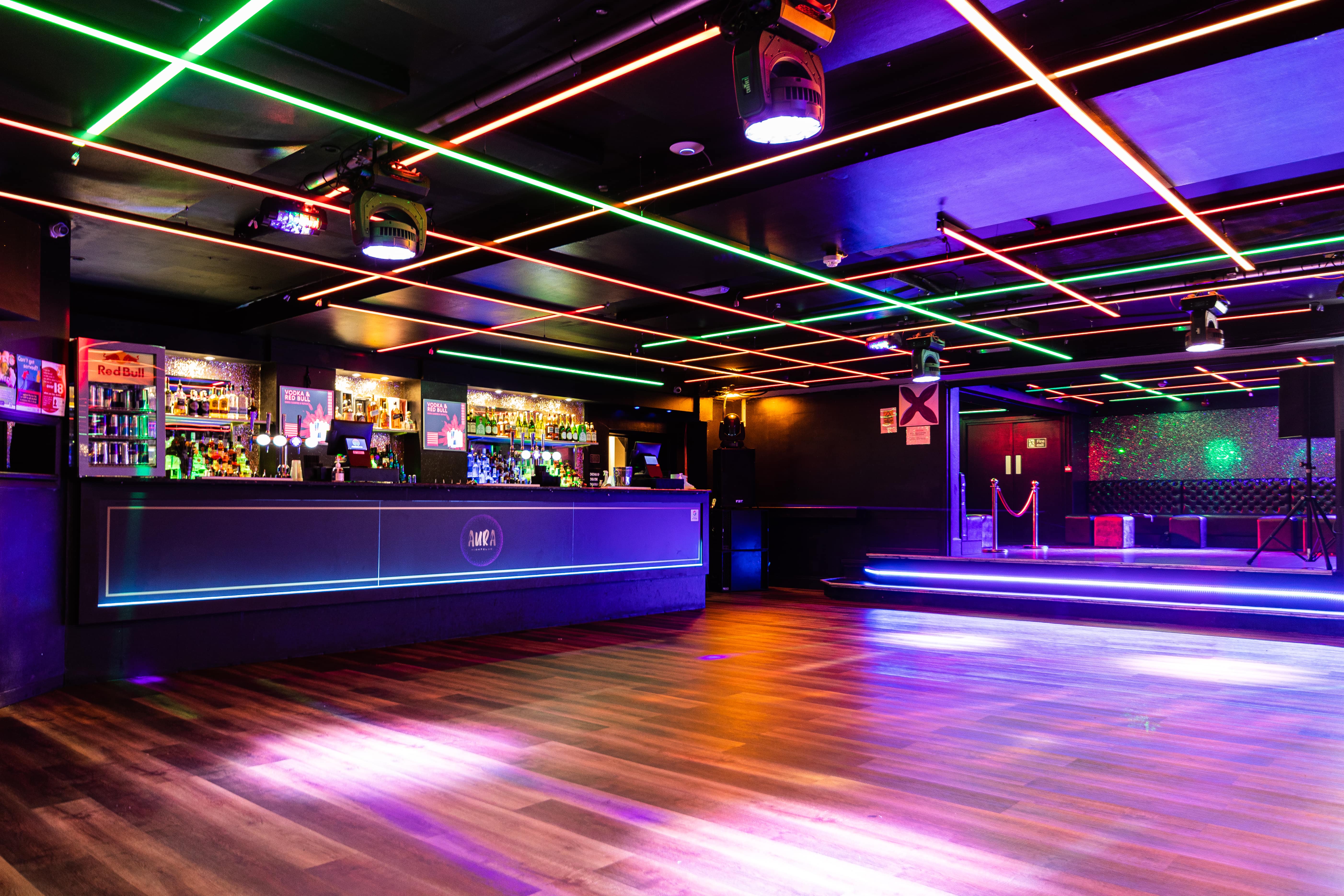 Modern event space in Aura Tunbridge Wells with vibrant lighting for parties and networking.