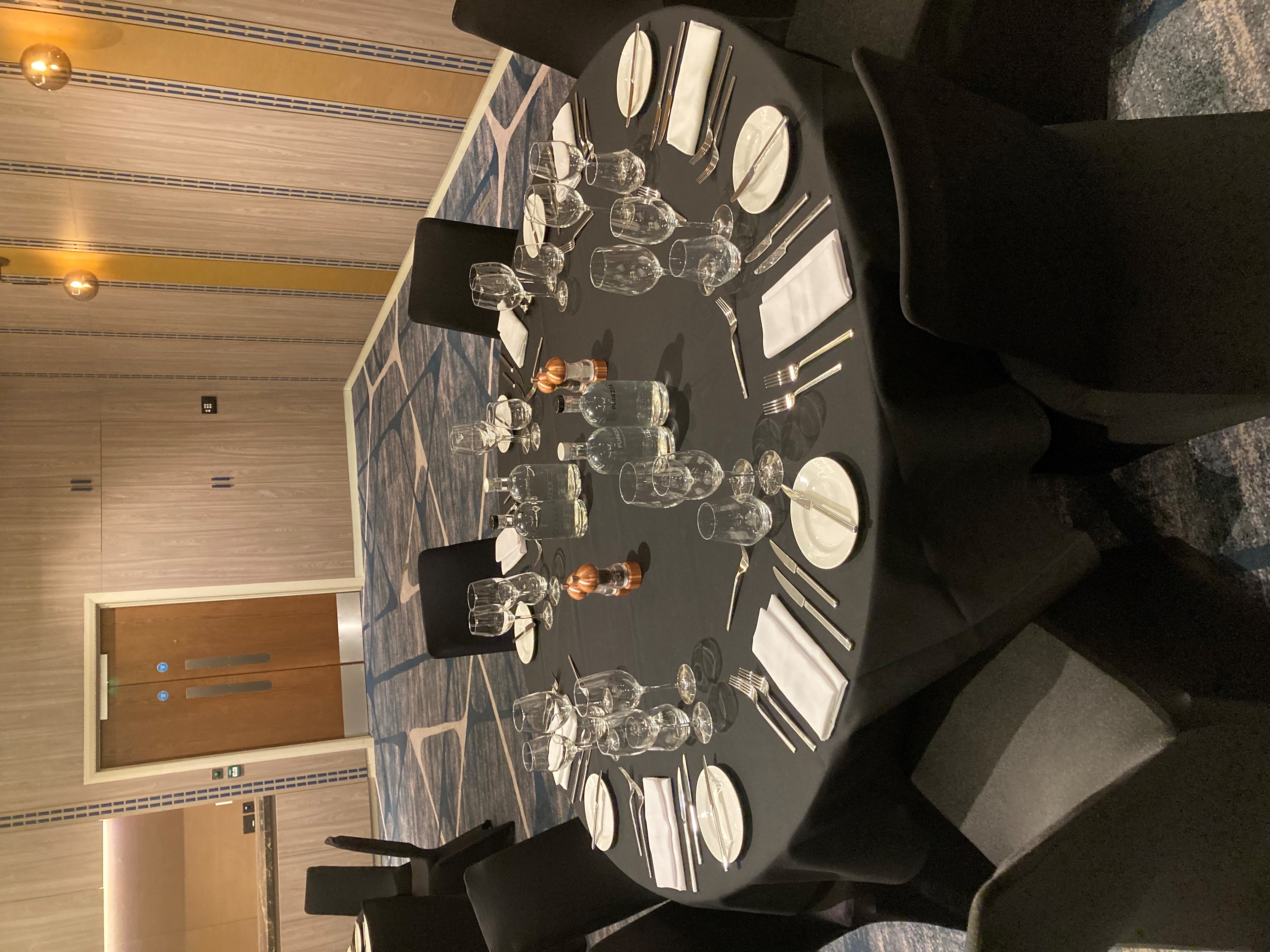 Elegant round table setup in The Lewis Room, Hyatt Regency Manchester for upscale events.