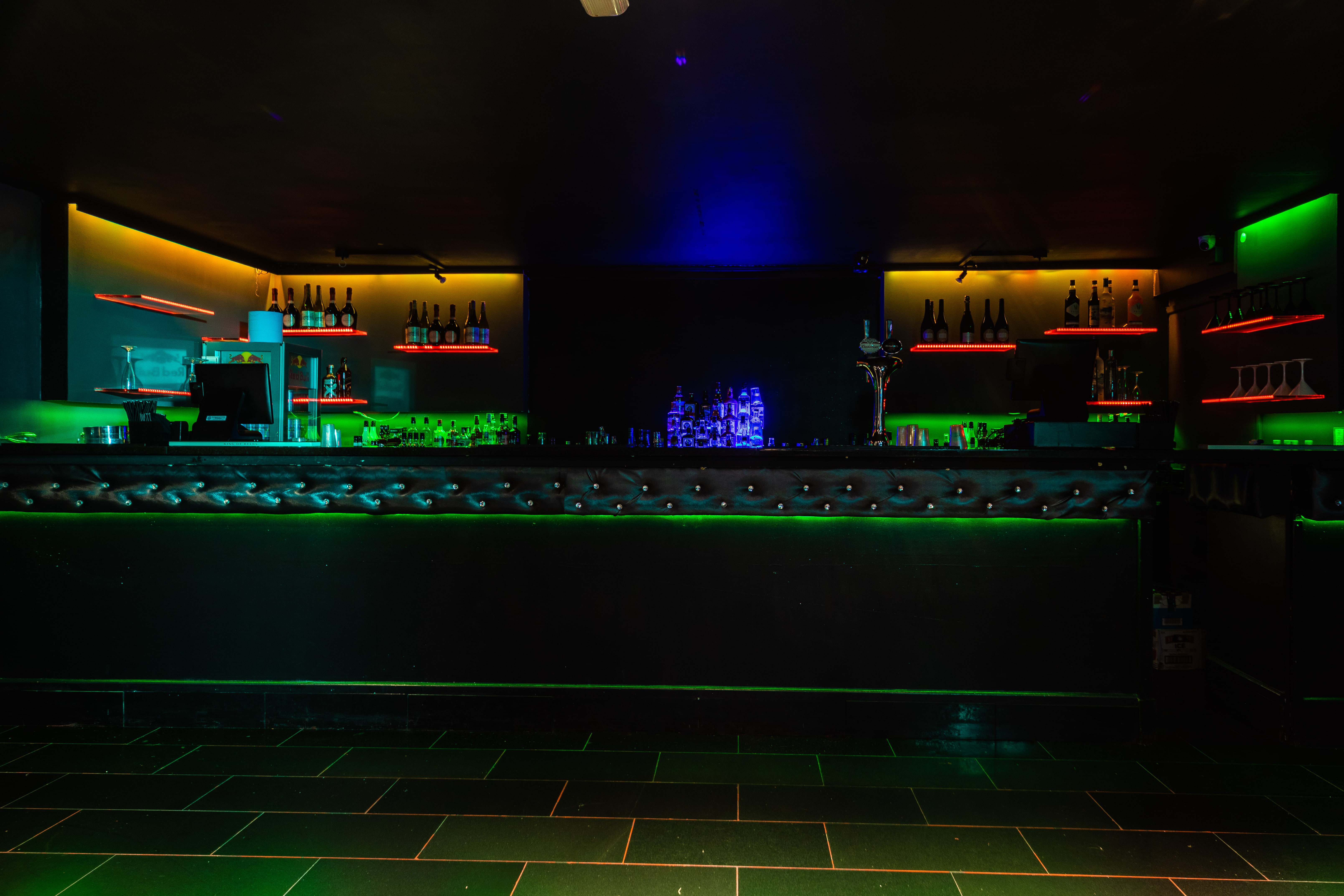 Sleek bar with vibrant lighting in Small Club Room, perfect for cocktail receptions.